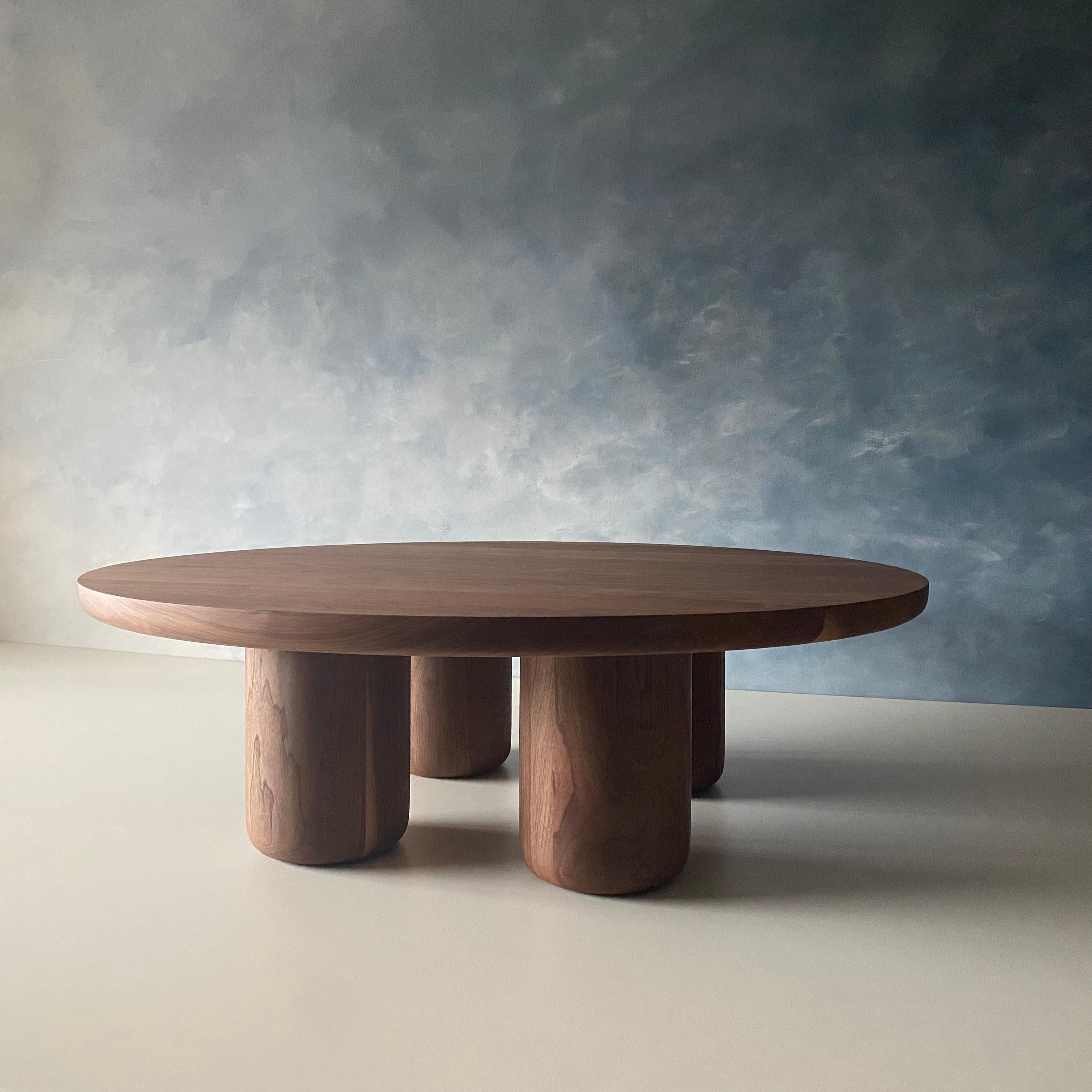 Our Tusker coffee table blends well in modern homes looking for something with a little character. Strong bold and robust with solid walnut legs turned by hand in our Vancouver based studio. Shown here in walnut with a semi-matte finish. Can be made
