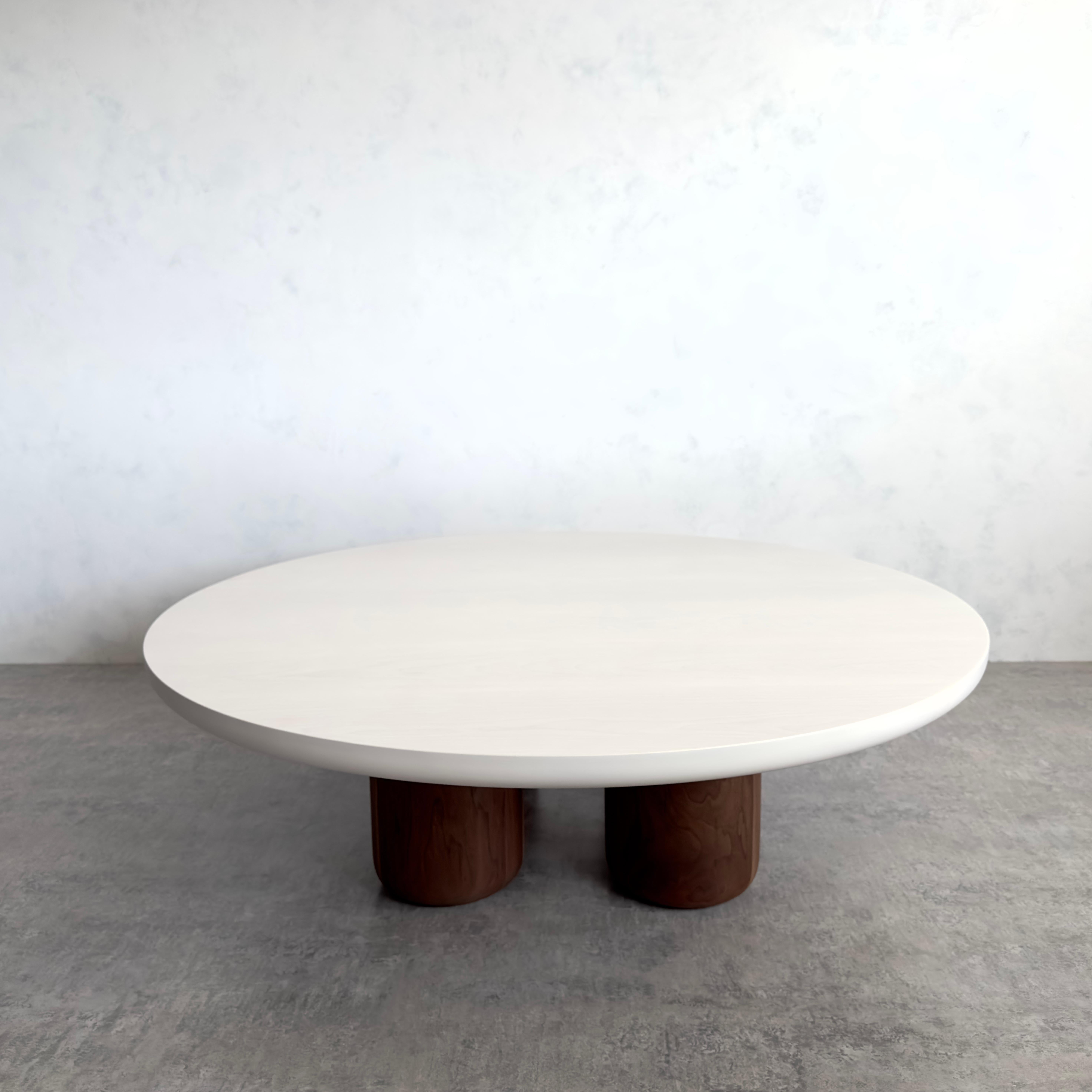 Our Tusker coffee table blends well in modern homes looking for something with a little character. Strong bold and robust with solid walnut legs turned by hand in our Vancouver based studio. Shown here with a whitened maple top and walnut legs with