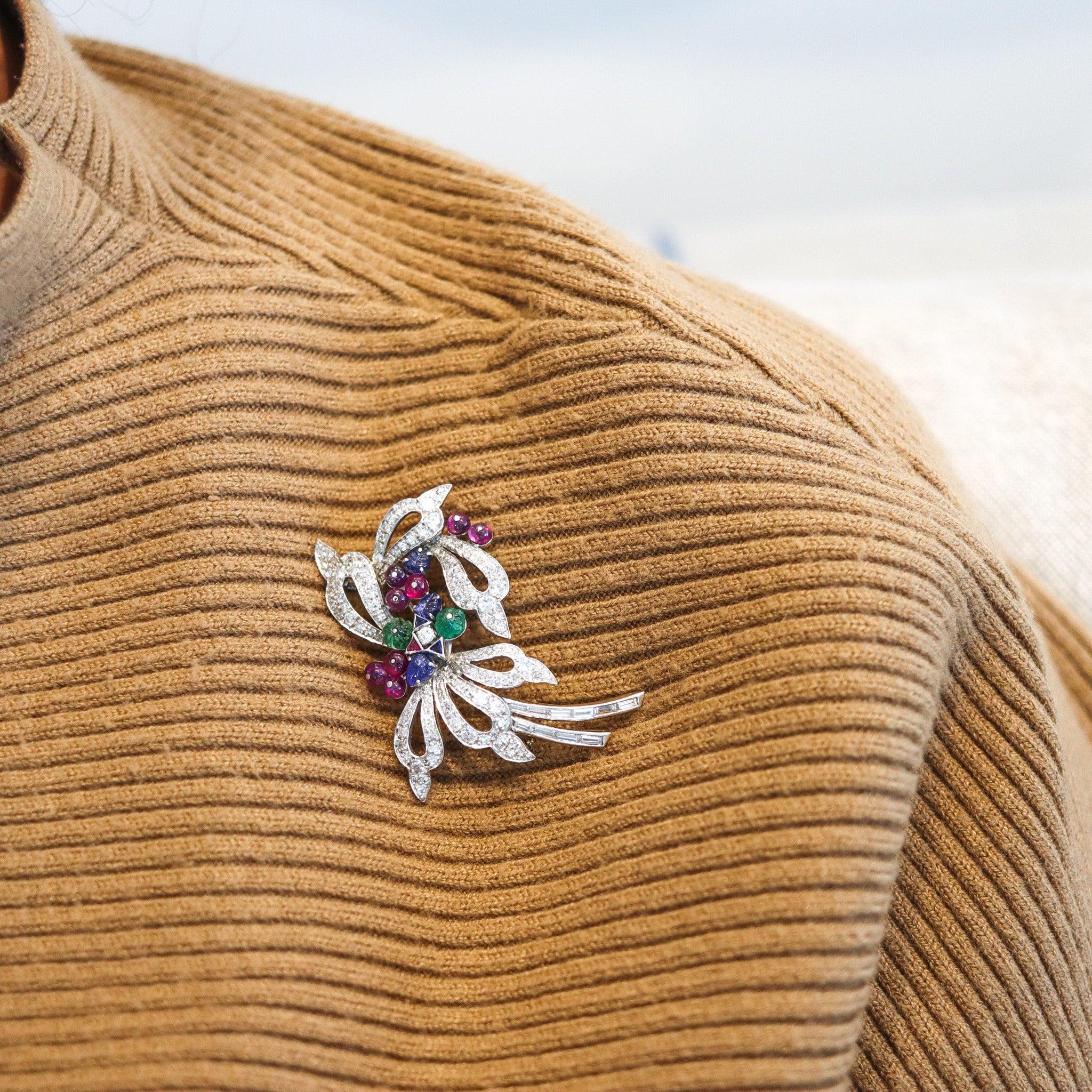 An art deco Tutti-Frutti gemstones brooch.

This is a gorgeous vintage brooch, created in America during the late art deco period back in 1940-1950. The brooch has been designed as a floral bouquet in solid .900/.999 platinum with high polished