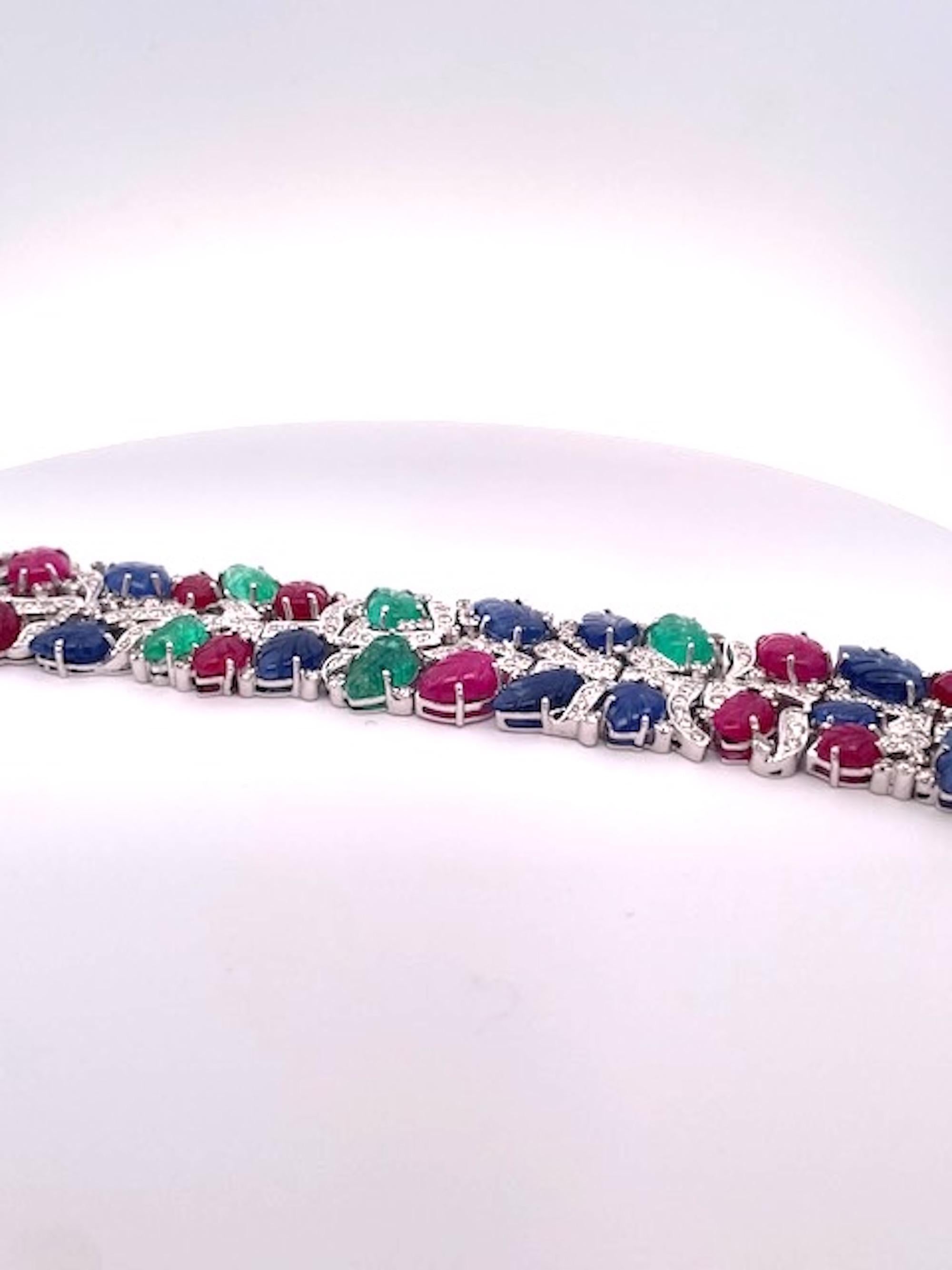 This Tutti Frutti Bracelet has all the bells and whistles it is gorgeous and amazing.  This bracelet weighs over 82.3 grams is 18K gold made in Italy.  This bracelet is 7.5 inches long and 1