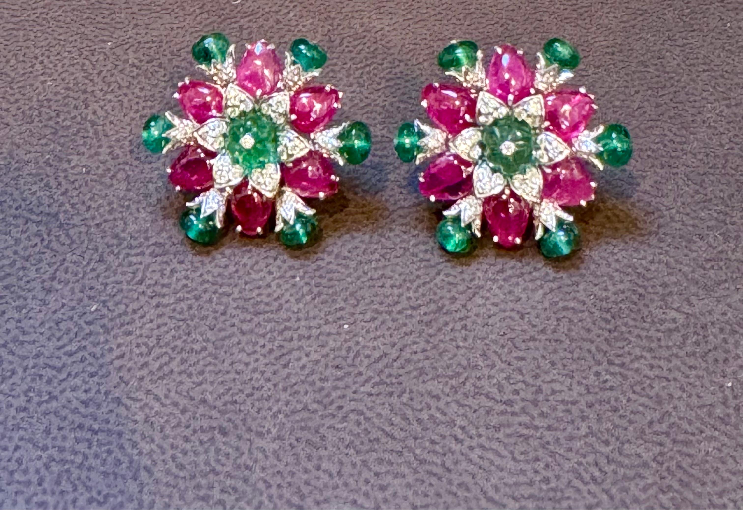 Tutti Frutti Earrings/ Natural  Emerald Rubellite Earrings/ Carving Leaf 18 Karat white Gold.
Discover elegance in our carved Rubellite and Emerald Diamond Post Earrings crafted with 18 Karat White Gold. The earrings feature  finely carved  emeralds