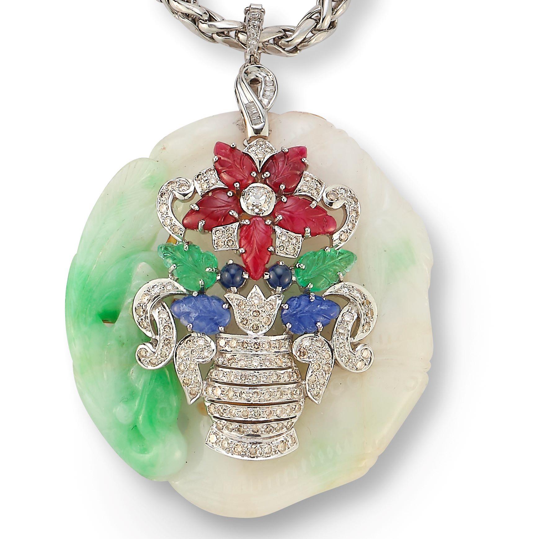 Tutti Frutti Jade Giardinetto Flower Pendant Necklace

This exquisite Cabochon Emerald & Diamond Flower Necklace is crafted in 18K yellow gold and showcases ten vibrant cabochon emeralds totaling approximately 17.00 carats. Each emerald is encircled