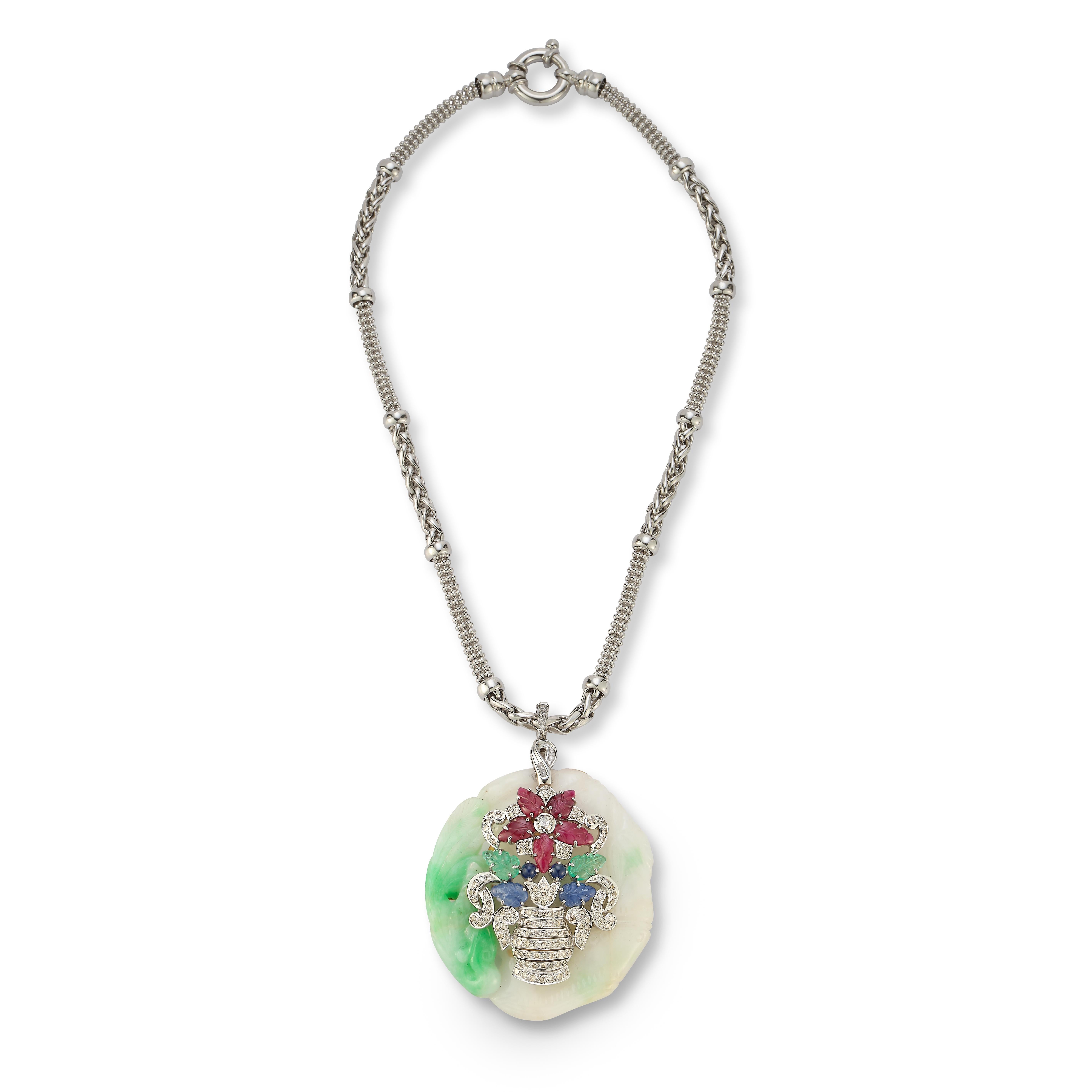 Tutti Frutti Jade Giardinetto Flower Pendant Necklace

Carved diamonds, rubies, sapphires, and emeralds set in 14k white gold,. Convertible into brooch

Measurements: Chain length 16