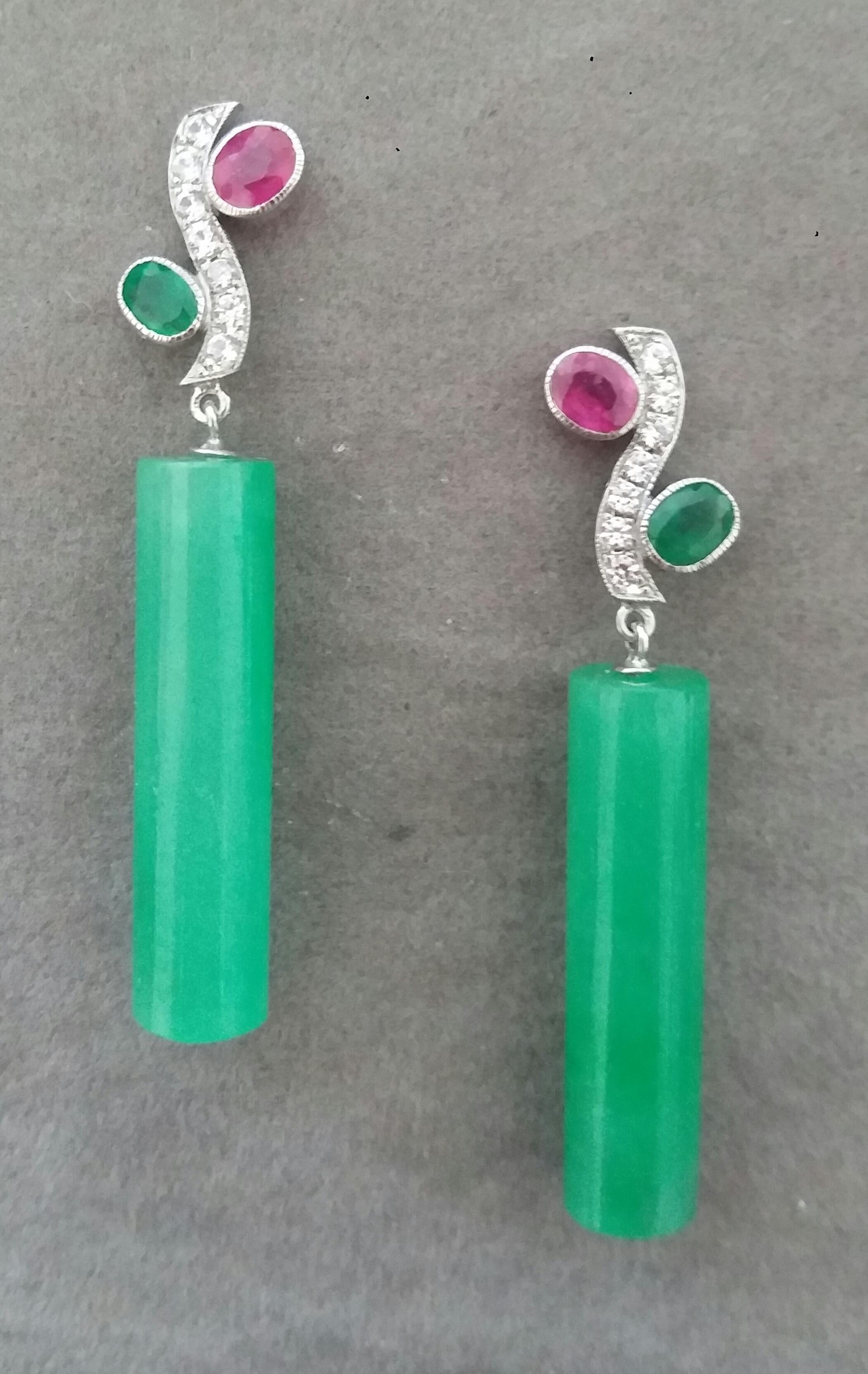 In these classic Tutti Frutti Style earrings the tops are 2 White Gold and Diamonds  Branches, 14 round full cut diamonds weighing 0,14 carats,and 3 pairs of faceted 4x5 mm. Rubies ,Emeralds and Blue Sapphires ,in the lower parts we have 2 Jade