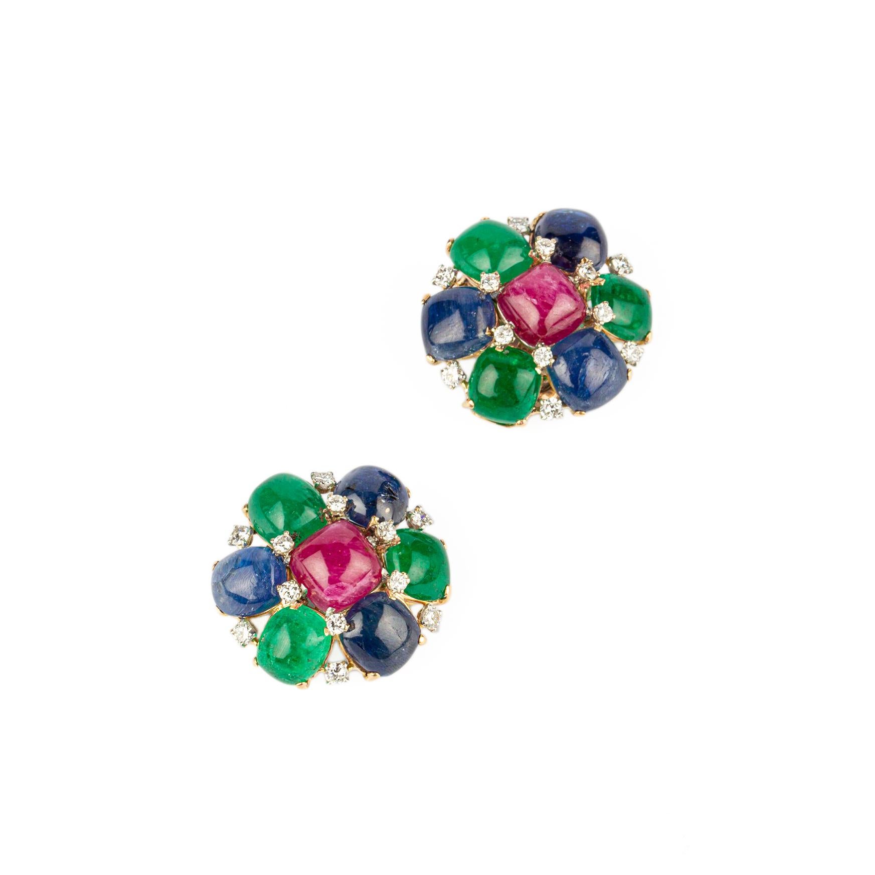 A pair of beautiful Tutti-Frutti clip-on Earrings with cabochon rubies, emeralds, sapphires, and diamonds mounted on 18k yellow gold, circa 1970. 
