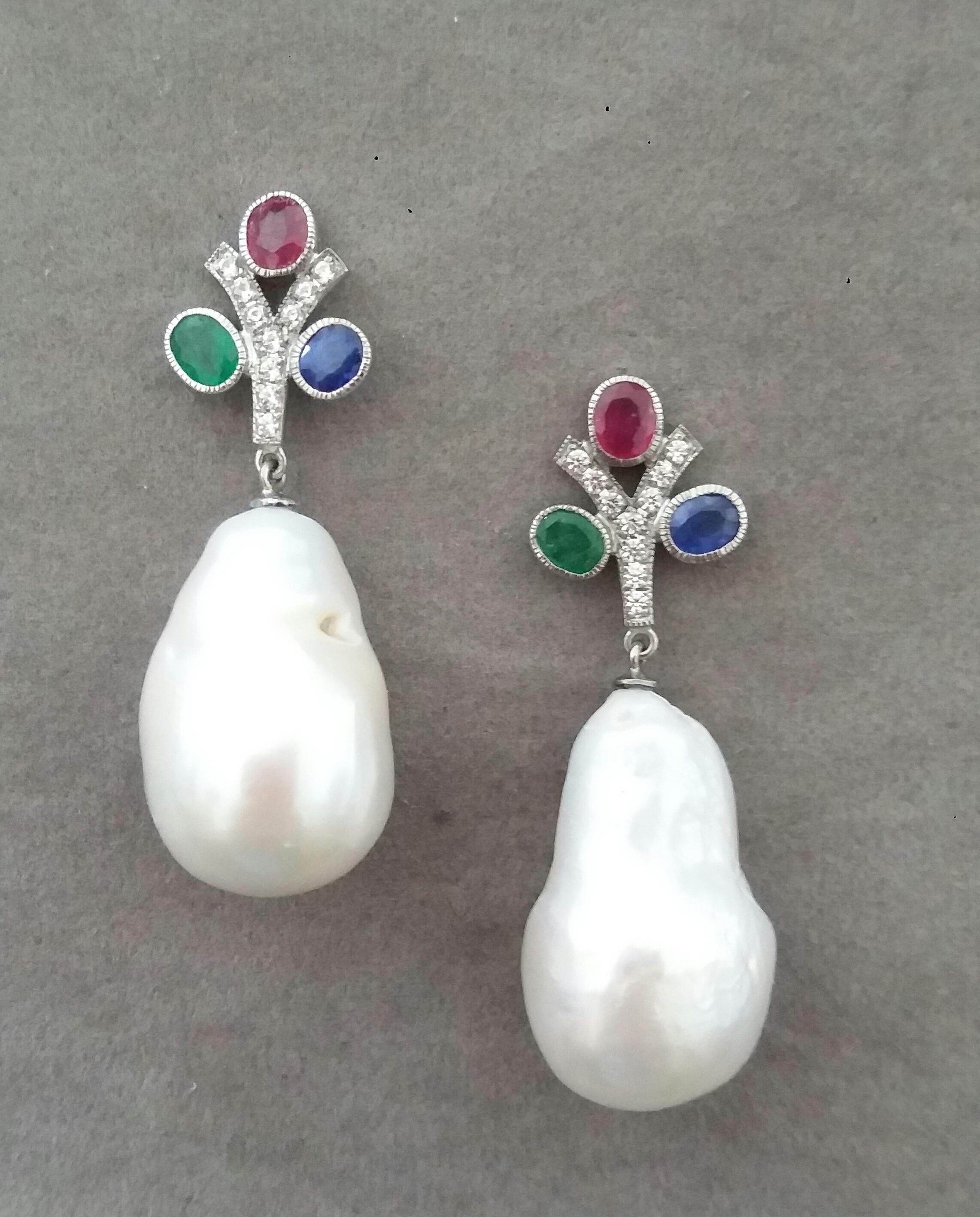 In these classic Tutti Frutti Style earrings the tops are 2 White Gold and Diamonds  Y shape Branches, 20 round full cut diamonds weighing 0,20 carats,and 3 pairs of faceted 4x5 mm. Rubies ,Emeralds and Blue Sapphires ,in the lower parts we have 2