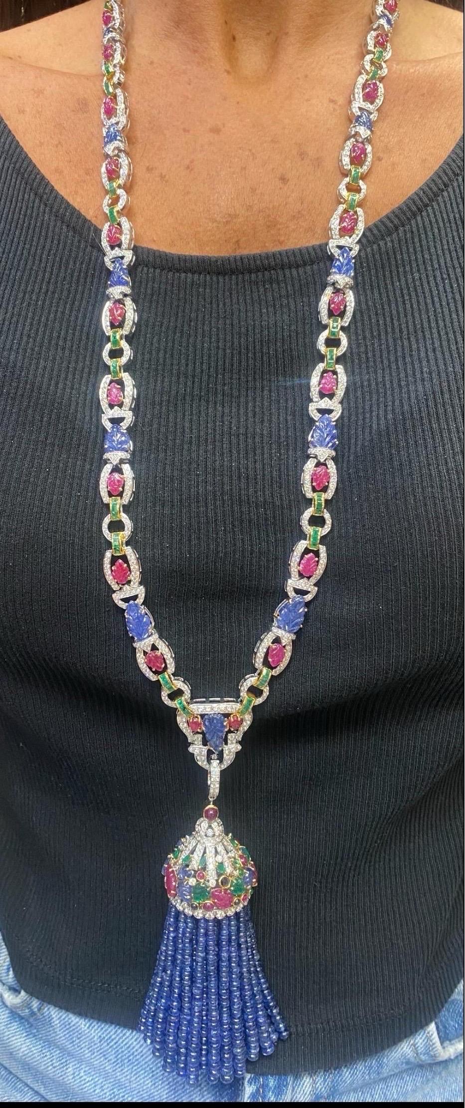Tutti Frutti Sautoir Tassel Necklace

A sautoir necklace set with carved rubies, emeralds, sapphires and diamonds. The tassel pendant is removable.

Approximate Stone Weights:
Diamond: 14.89 carats
Sapphire: 40.67
Sapphire Beads: 493.84 carats
Ruby: