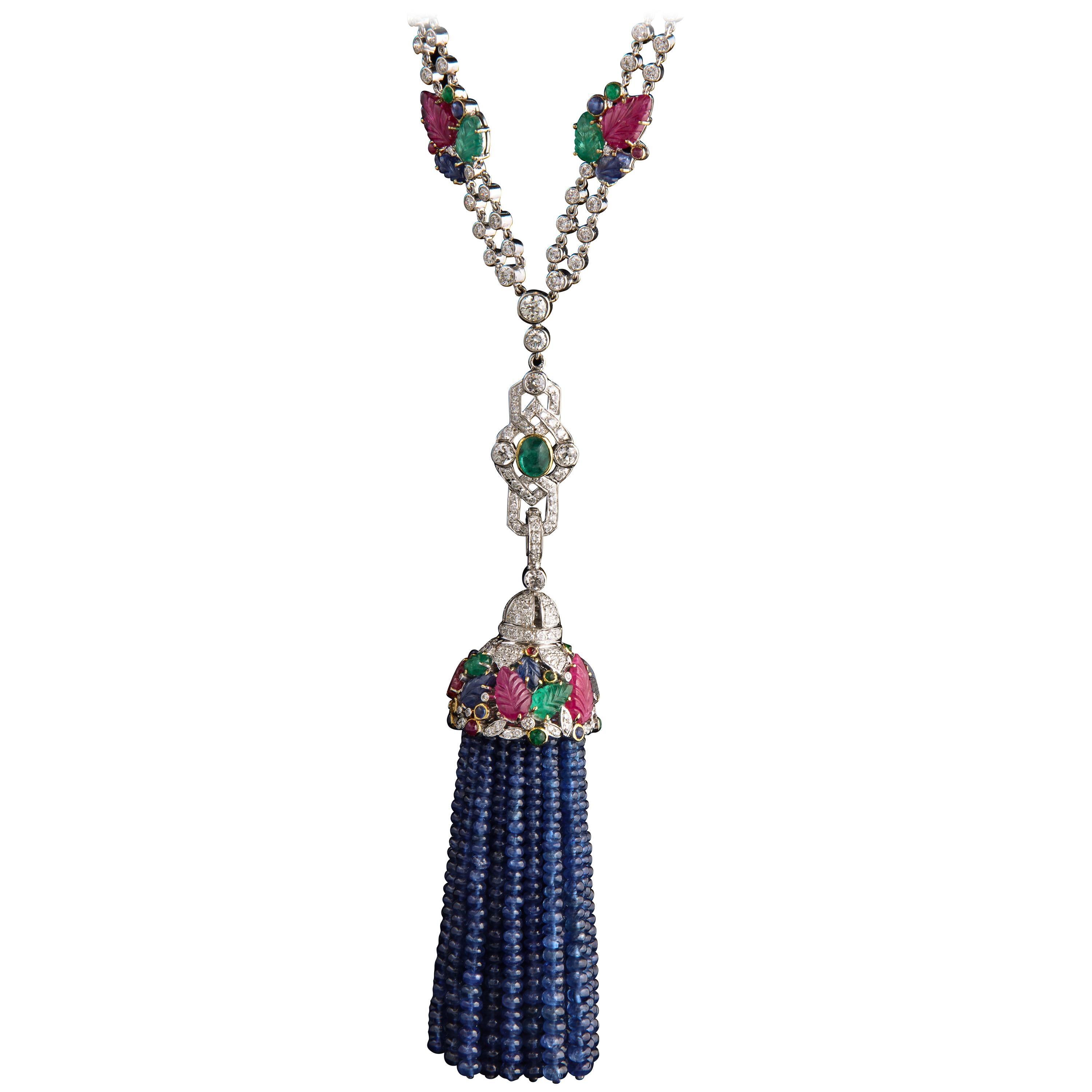 Tutti Frutti Sautoir length Tassel Necklace

Tassel is detachable

Length with the tassel is approx 38 inches

Diamonds approx 7.49 Cts.
Emerald  approx 16.95 Cts.
Sapphire approx 437.25 Cts.