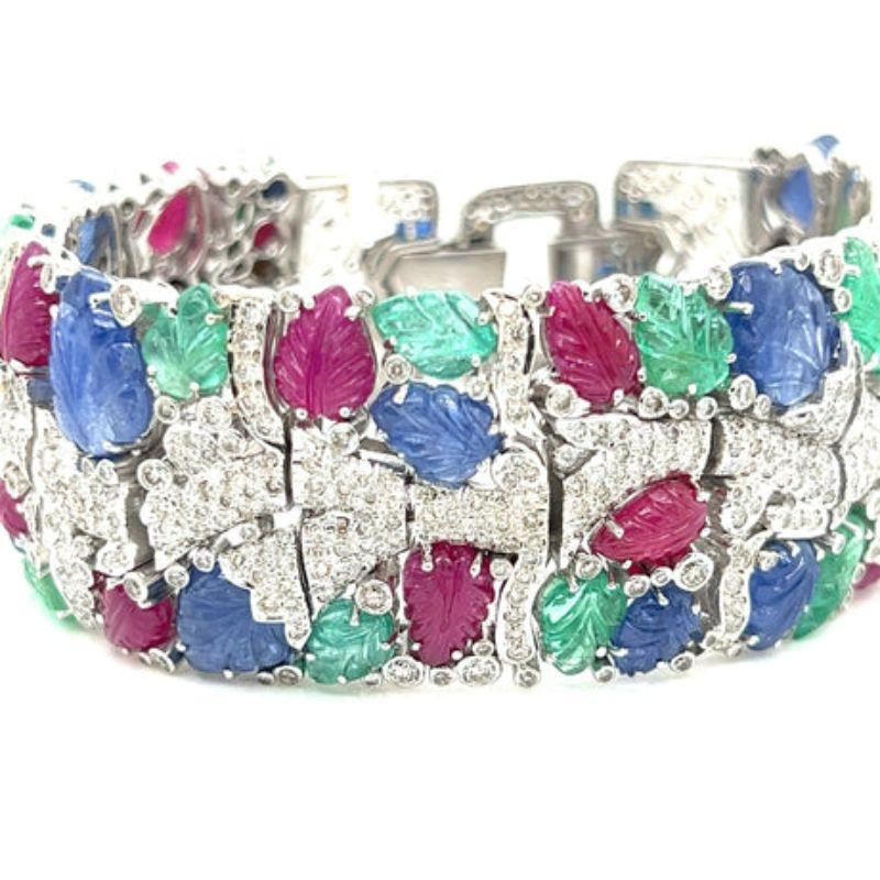 Tutti Frutti Style Art Deco Bracelet

This exquisite bracelet features 12.52 cttw of glamorous diamonds and skillfully carved cabochon gemstones in a classic Art Deco design. Combining old-world craftsmanship with modern elegance, this timeless