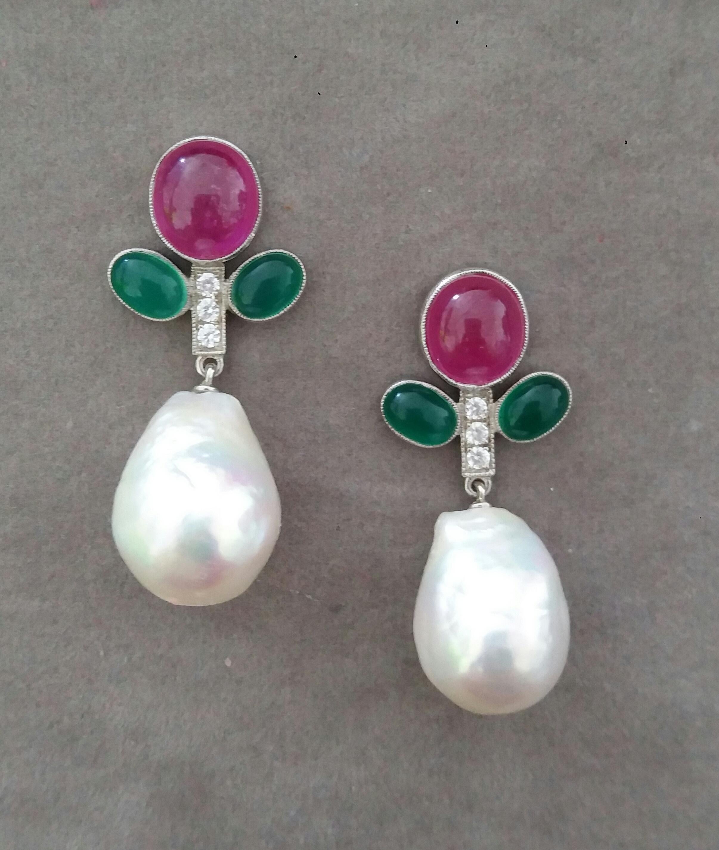In these classic Tutti Frutti Style earrings the tops are 2 White Gold Branches, 6 round full cut diamonds weighing 0,18 carats,and 2 pairs of  oval Green Onyx cabs measuring 5x7 mm. and 1 pair of oval Ruby cab measuring 8x10 mm ,in the lower parts