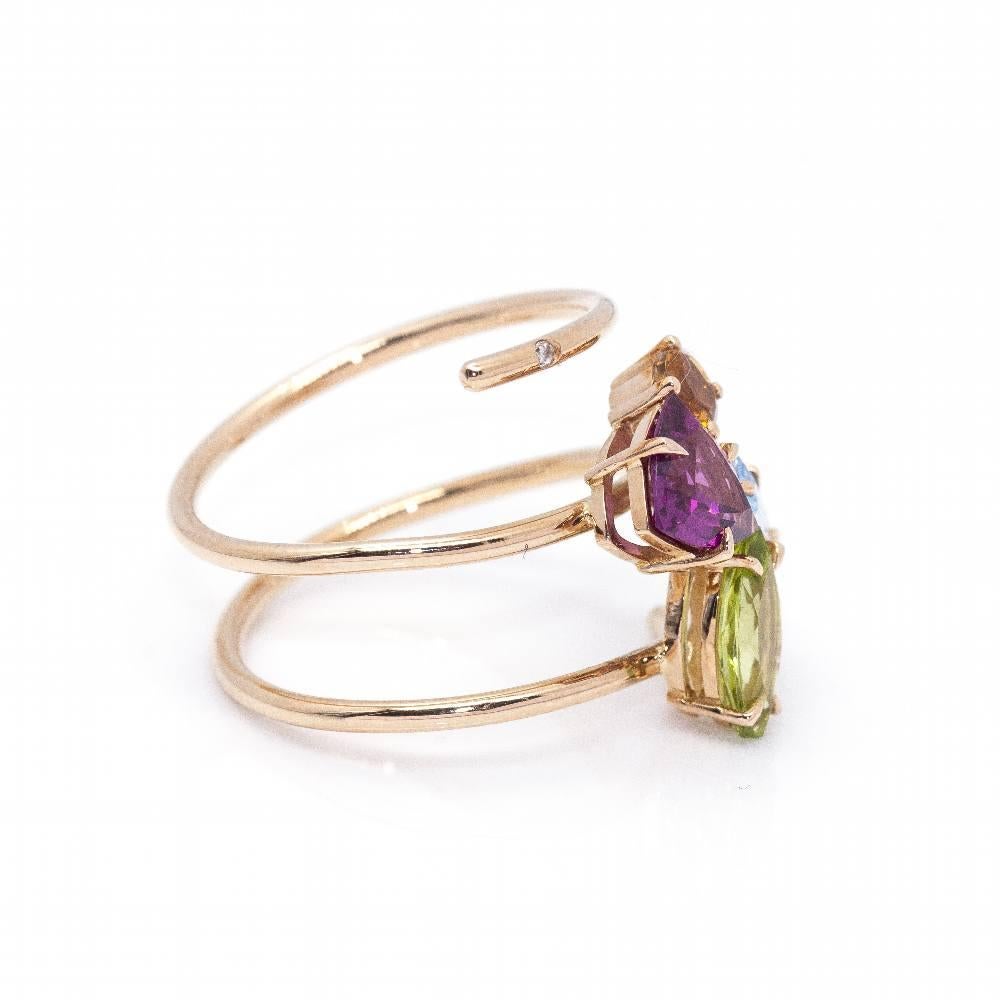 Rose Gold Ring for woman  1x Brilliant Cut Diamonds with a total weight of 0,005cts in H/VS quality  1x Marquisse cut green Peridot, 1x Baguette cut blue Topaz, 1x Trillon cut garnet Rhodolite and 1x Size 9 round Tourmaline  18kt Rose Gold  3,36