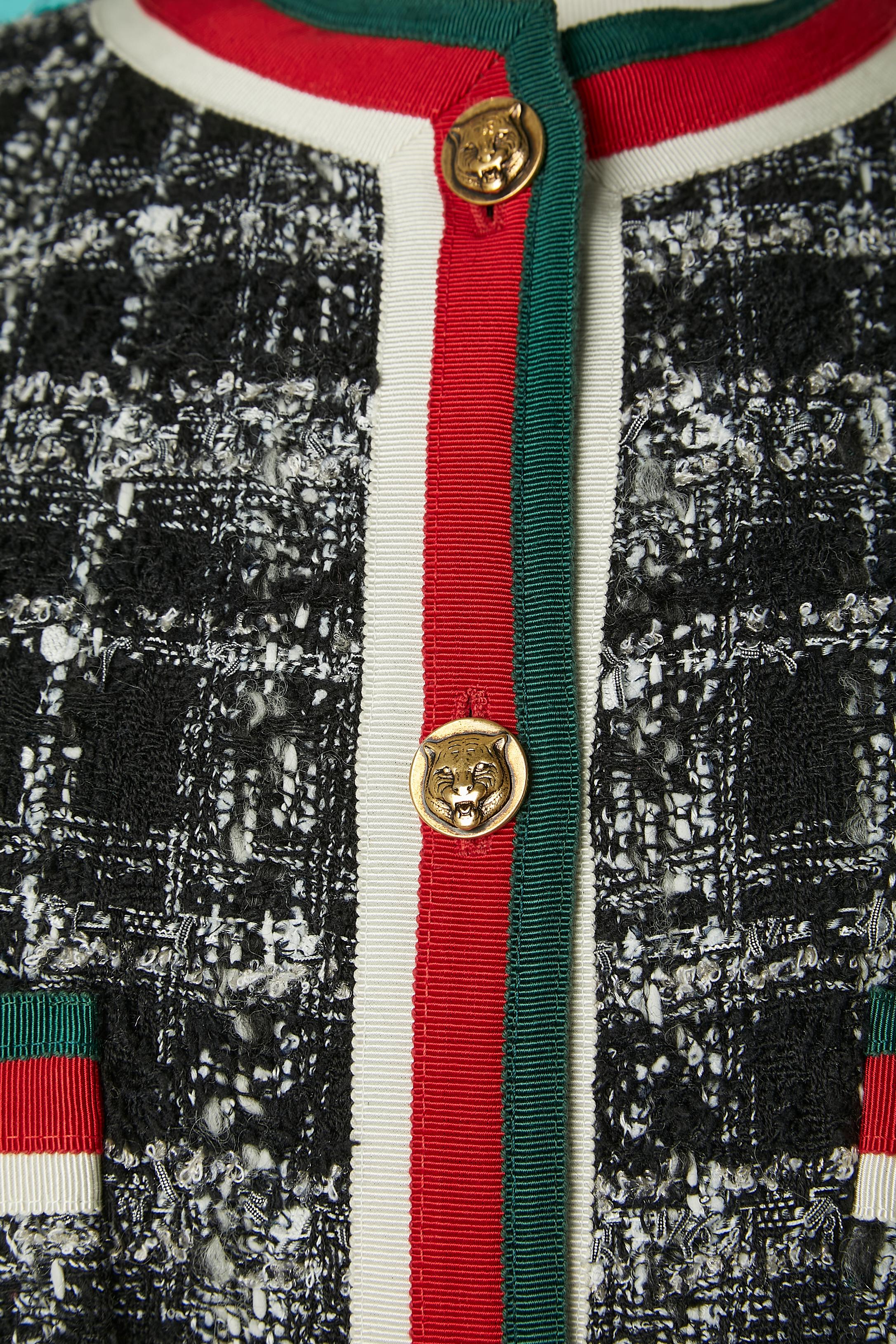 Tweed jacket with white, red & green trimming and gold metal jaguars button. 
Main fabric composition: 33% wool, 28% polyester, 15% polyamide, 11% cotton, 9% acrylic, 4% rayon. 
Trimming: 50% cotton, 50% rayon. Lining: 73% Cupro, 27% silk.
SIZE 38 /