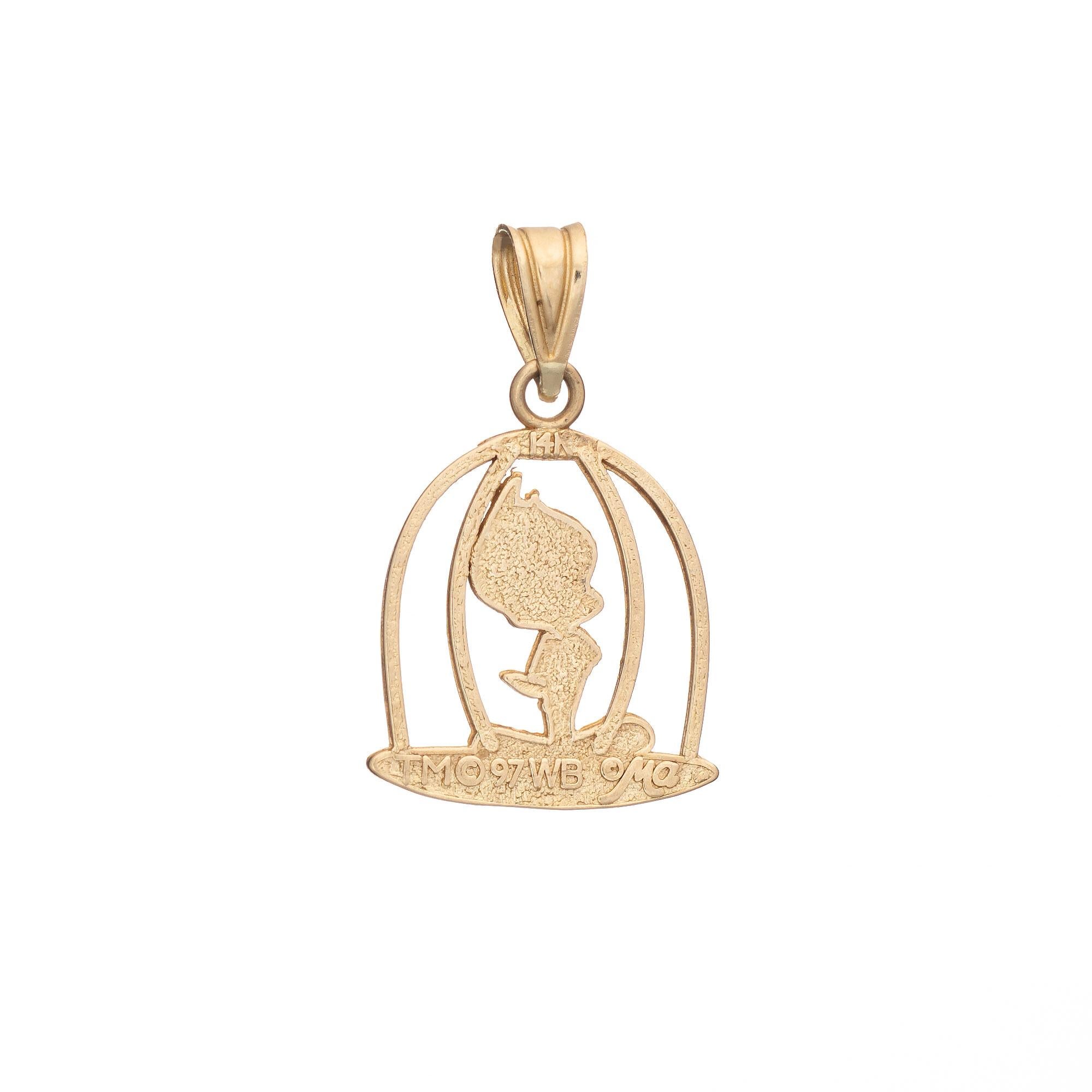 Finely detailed vintage Tweety Bird in Cage charm crafted in 18k yellow gold (circa 1997).  

The sweet charm is nicely detailed, featuring Tweety Bird perched in a cage. Small in scale the piece is ideal worn as a pendant or on a charm