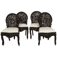 Twelve 19th Century Anglo-Indian Carved Dining Chairs