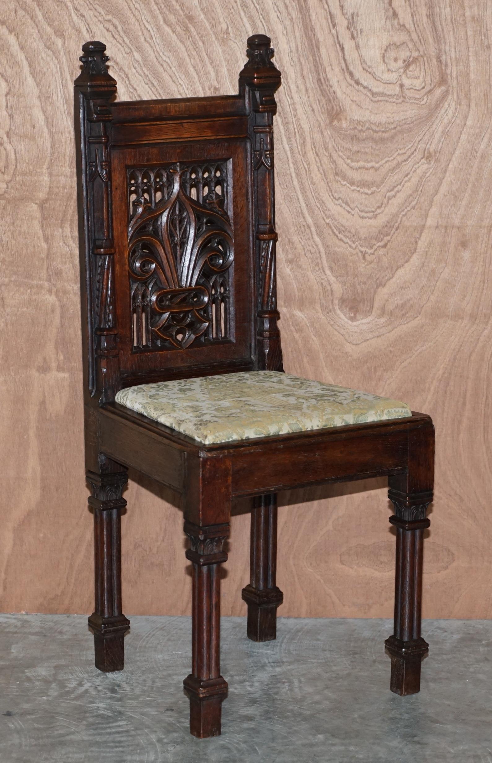 We are delighted to offer this stunning suite of twelve circa 1800 Gothic revival, hand carved oak dining chairs with early silk embroidered upholstery, most likely from France

These chairs were purchased by a private client over 20 years, they