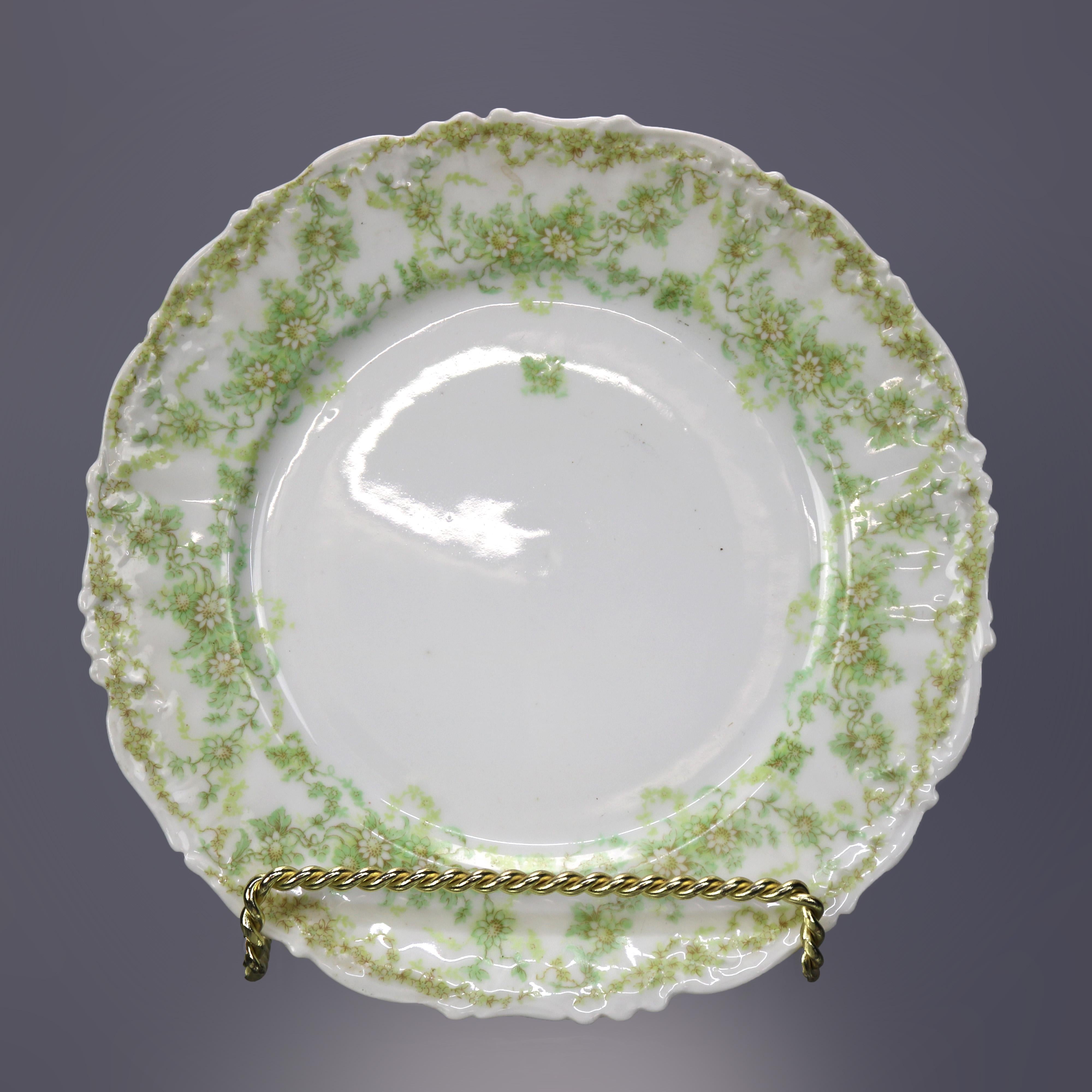 A French antique set of twelve fine china salad plates by Limoges France Elite Works offers shaped rims with foliate and floral decoration, maker mark as photographed, c1900

Measures - 1