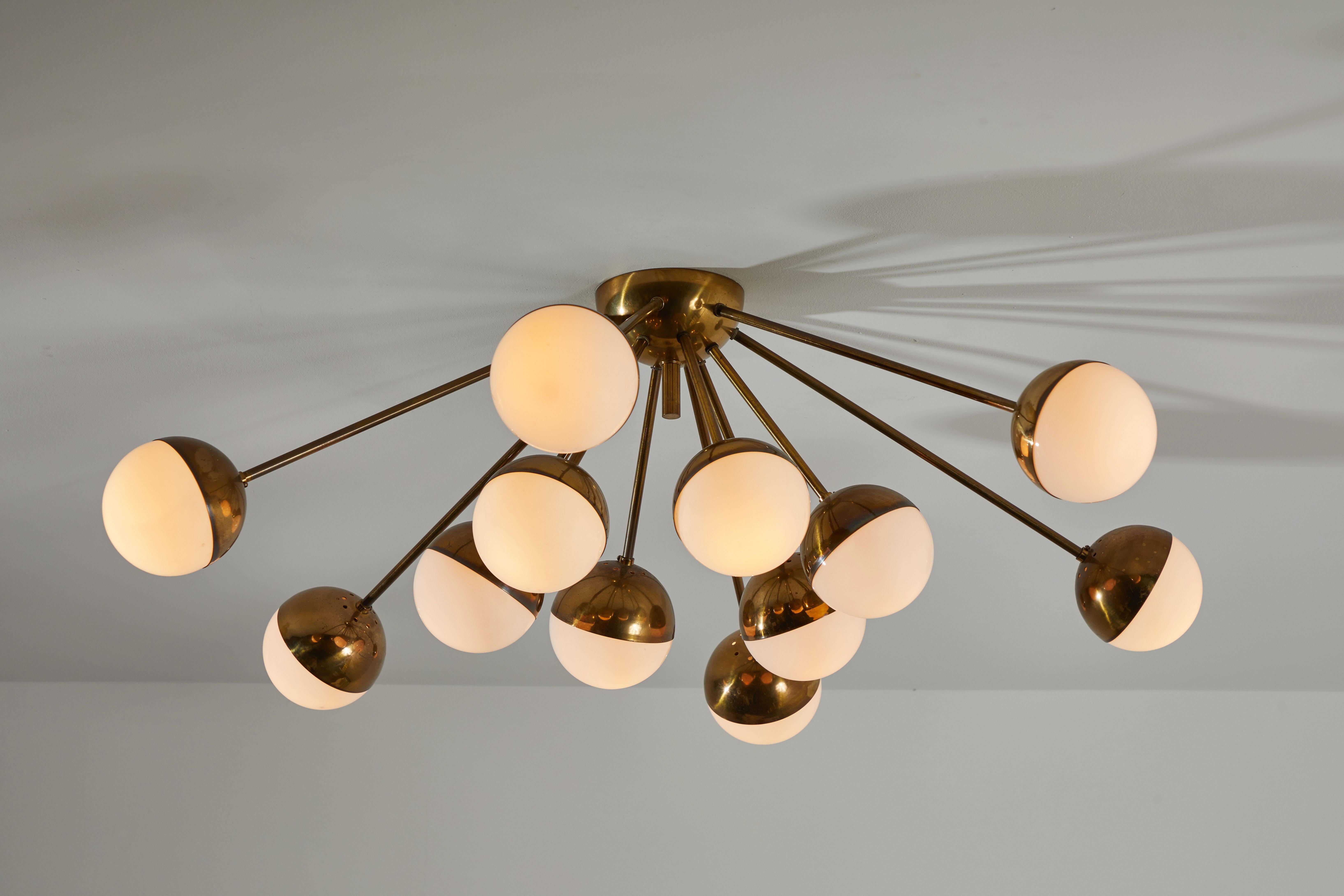 Twelve-arm ceiling light by Stilnovo. Manufactured in Italy, circa 1950s. Brass and brushed satin glass diffusers. Rewired for US junction boxes. Takes twelve E27 European candelabra 40w maximum bulbs.