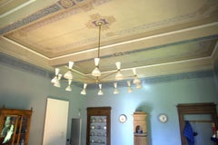 Twelve Arms Natural Patina Brass Chandelier, Ivory Pivoting Heads, Twin Bulbs