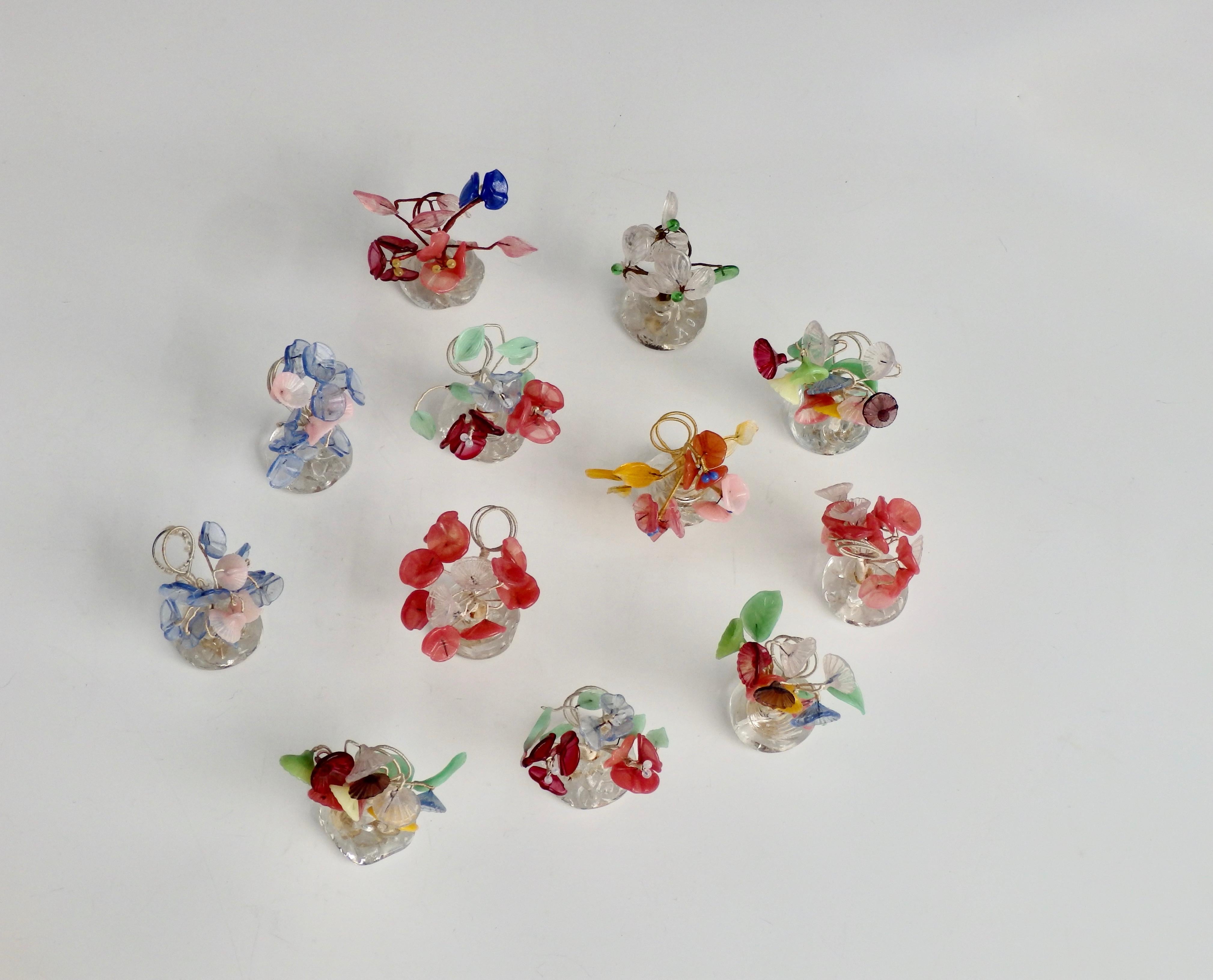 Finely crafted colorful glass flower place card holders.