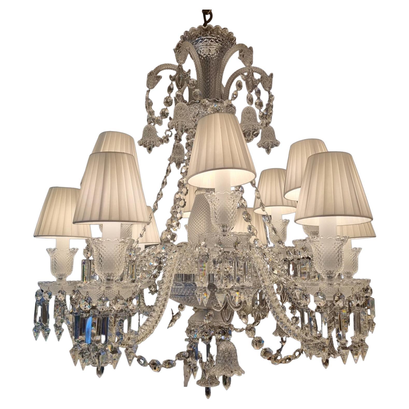 Fabulous Baccarat Crystal Chandelier
This Chandelier has a beautiful Cut Crystal Central Stem and Each Arm has Sparkling Crystal Pendants that Reflect Beautifly When Lit
Baccarats single Red Crystal Displayed Discreetly 
Theres a Waiting list to buy