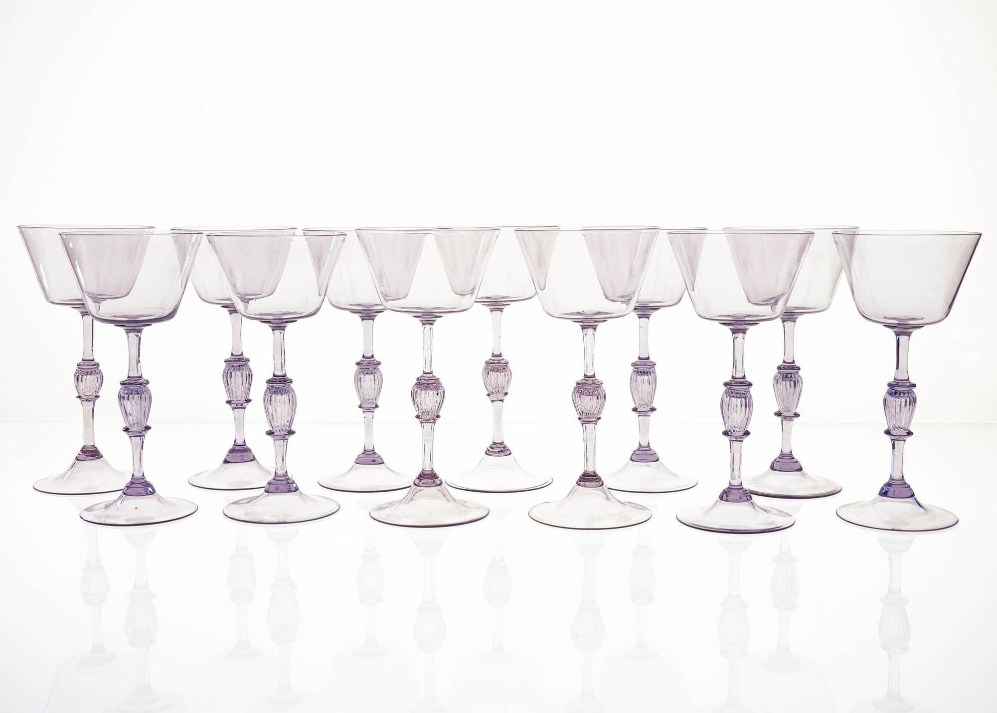 Introducing an Unique and Rare Set of 12 Cyclamen Glass Flutes.
Made in Murano on the 50ties by Cenedese. Almost impossible to find a full 12 pieces set.
This full set of 12 cyclamen glass flutes is a must-have for any collector of vintage glass or