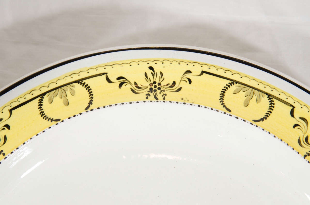 English Twelve Creamware Dinner Plates with Yellow Neoclassical Borders Made circa 1800