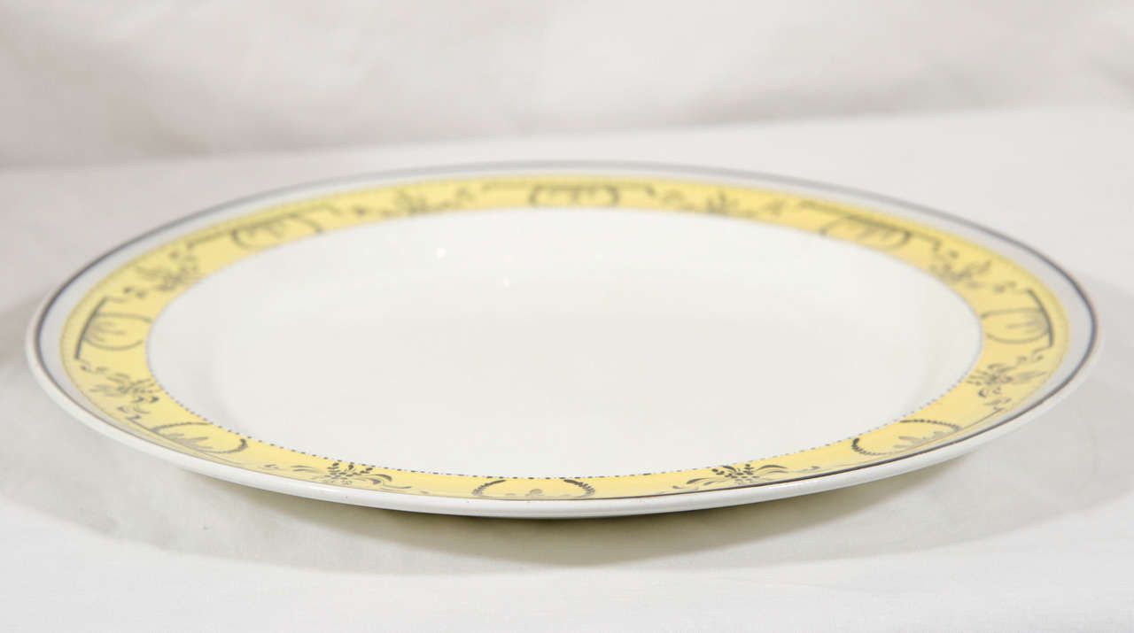 Earthenware Twelve Creamware Dinner Plates with Yellow Neoclassical Borders Made circa 1800