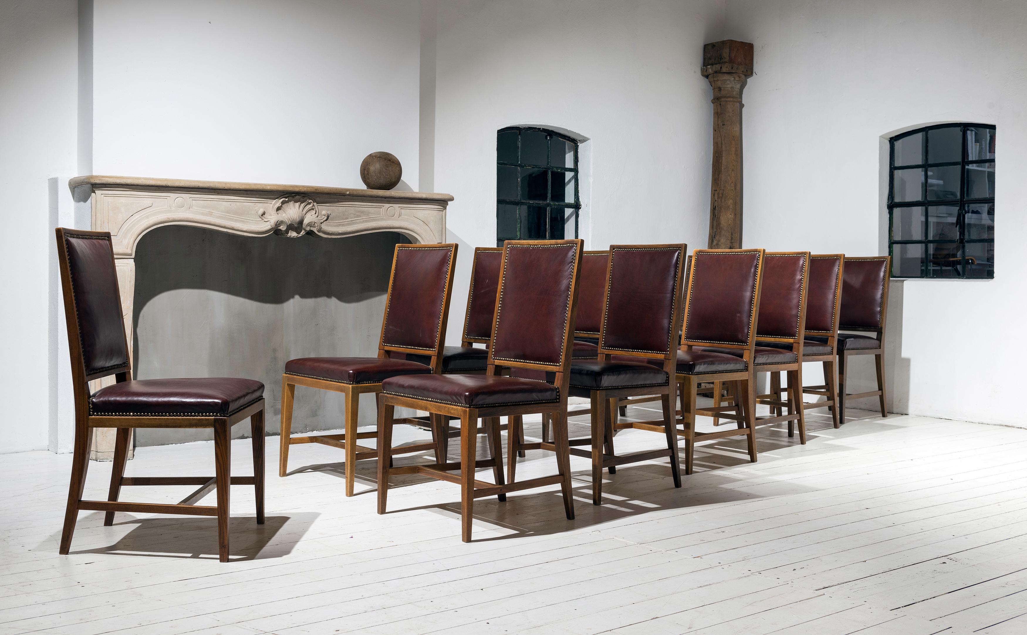 Mid-20th Century Twelve Elegant Mahogany and Leather Dining Chairs Inspired by Jean-Michel Frank