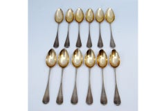 Twelve gold-plated guilloche coffee spoons with monogrammed handles