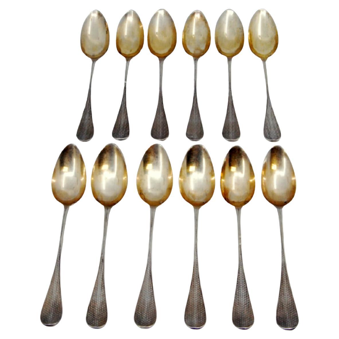 Twelve gold-plated guilloche coffee spoons with monogrammed handles