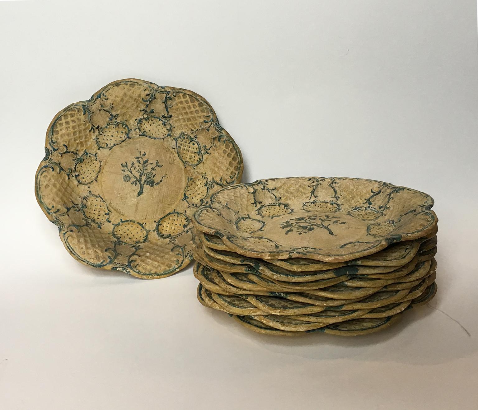 Twelve papier mâché dishes
Italy, last quarter of the 18th century

Each measures 9.05 in (23 cm) in diameter.
The twelve dishes weigh 1.94 lb (882 g)
Slight abrasions from use.

The art of papier-mâché is considered an artistic expression of
