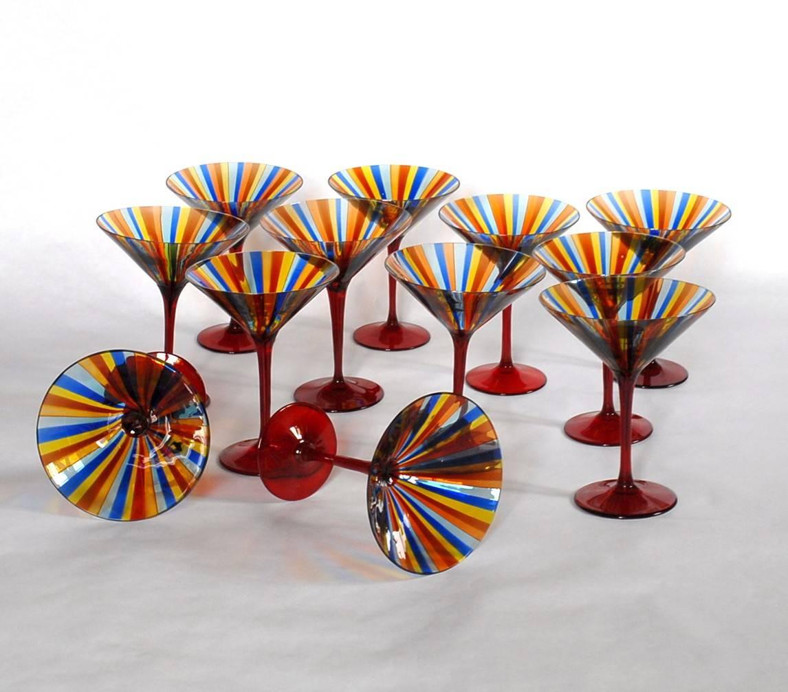 The Classic Cendese pattern a canne that he used on shades and vessels was also produced on glassware set. Sets are hard to find. I am pleased to offer now a full set of twelve with cadmium red stem.

It's coming from the same owner of the previous