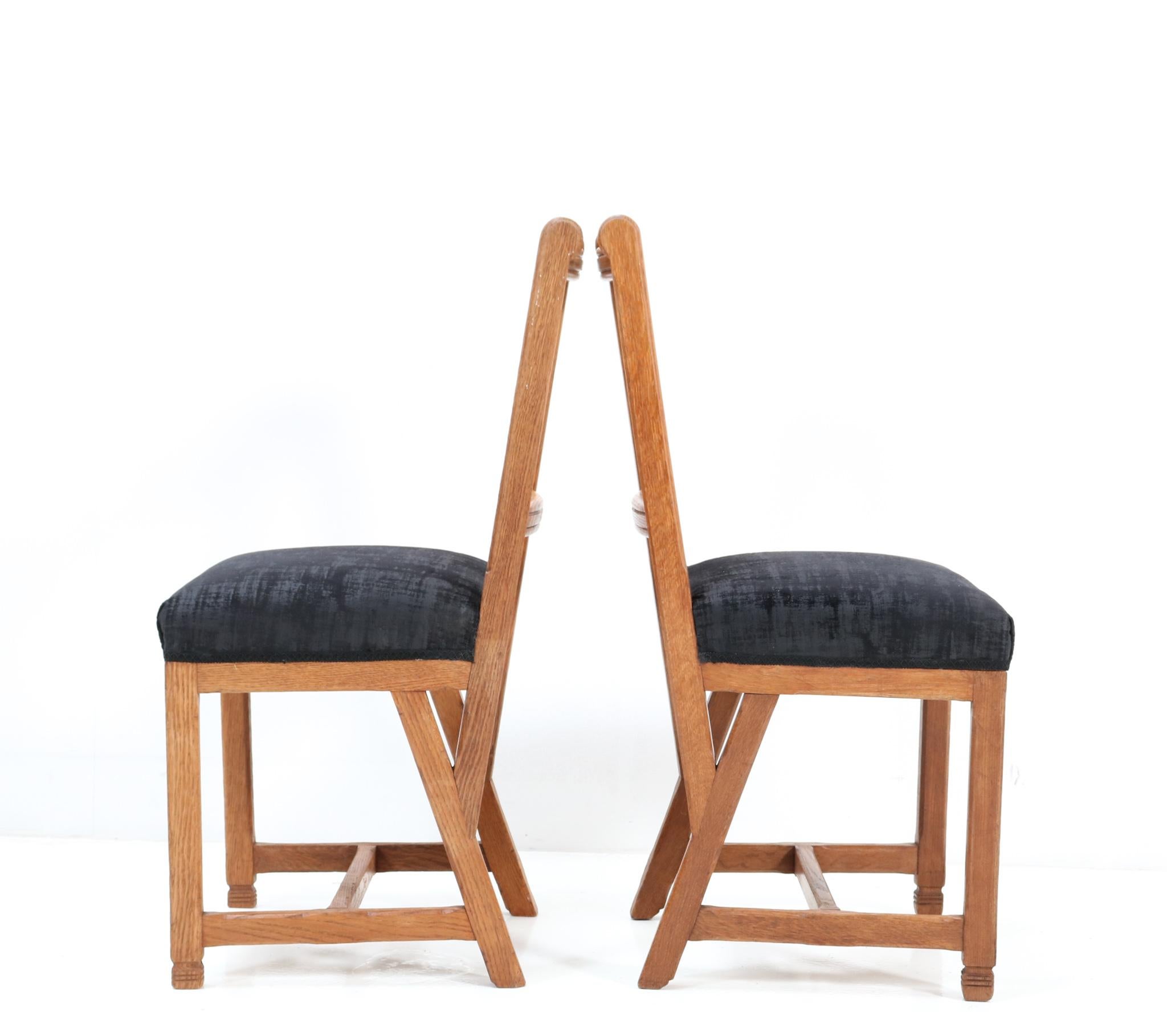 Early 20th Century Twelve Oak Arts & Crafts Chairs by Hendrik Petrus for the University of Leiden For Sale