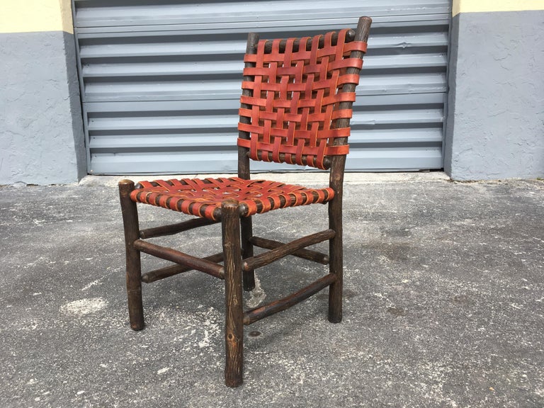 Twelve Old Hickory Dining Chairs with Woven Cognac Saddle Leather For