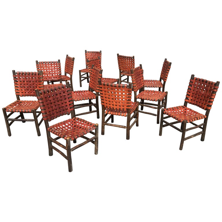 Twelve Old Hickory Dining Chairs with Woven Cognac Saddle Leather For