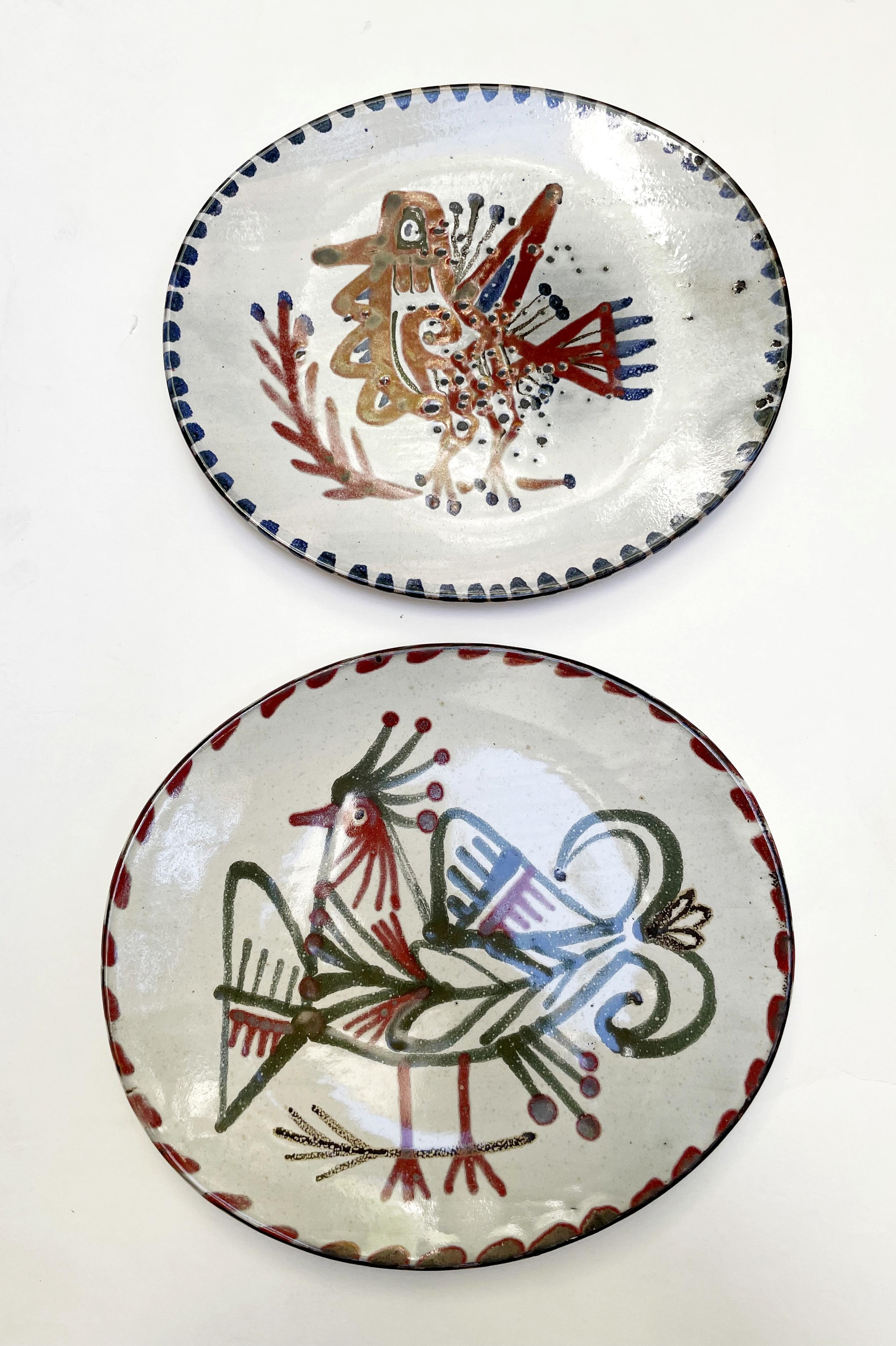 Jean Derval and (1925-2010) and Gustave Reynaud (1915-1972).
Twelve plates decorated with fantastic birds and fish.

Gustave Reynaud is documented in 1956 in Vallauris; he founded the Le Murier pottery, and there sold table services based on the