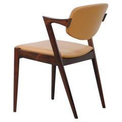 Twelve Restored Customizable Kai Kristiansen Model 42 Rosewood Dining Chairs