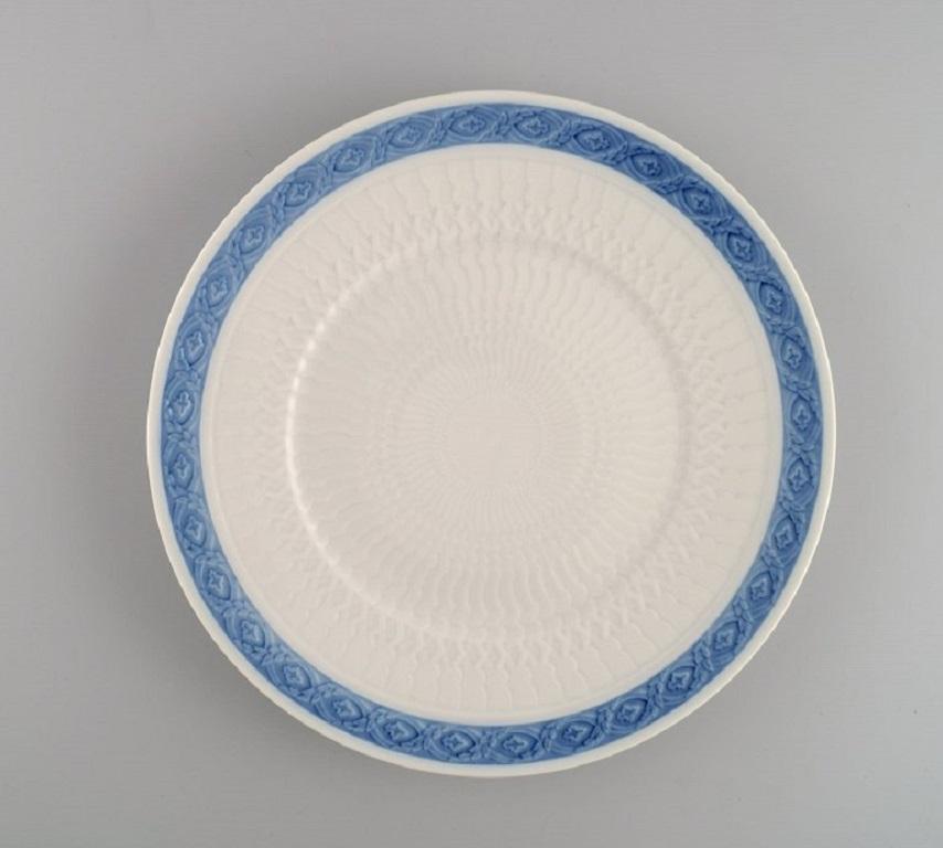 Twelve Royal Copenhagen Blue Fan dinner plates. 1960s / 70s. 
Model number 1212/11519. Designed by Arnold Krog in 1909.
Diameter: 25.5 cm.
In excellent condition.
Stamped.
1st factory quality.