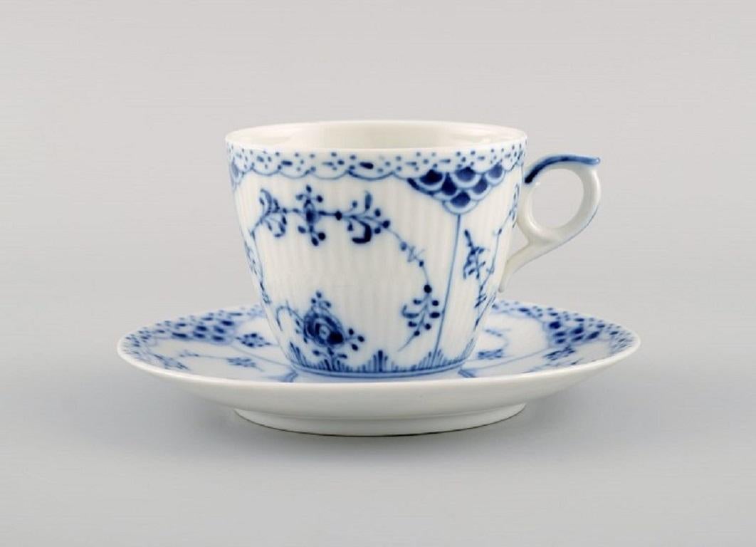 Twelve Royal Copenhagen blue fluted half lace coffee cups with saucers. Model number 1/719. 
Mid-20th century.
The cup measures: 7.2 x 6.2 cm.
Saucer diameter: 12.7 cm.
In excellent condition.
Stamped.
2nd factory quality.