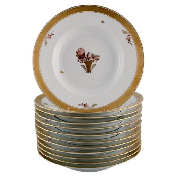 Dodici piatti profondi Royal Copenhagen Gold Basket in porcellana con fiori