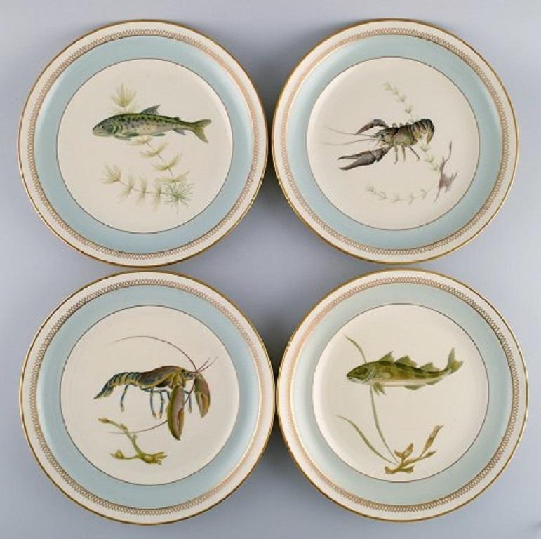 Twelve Royal Copenhagen Porcelain Dinner Plates with Hand-Painted Fish Motifs 1