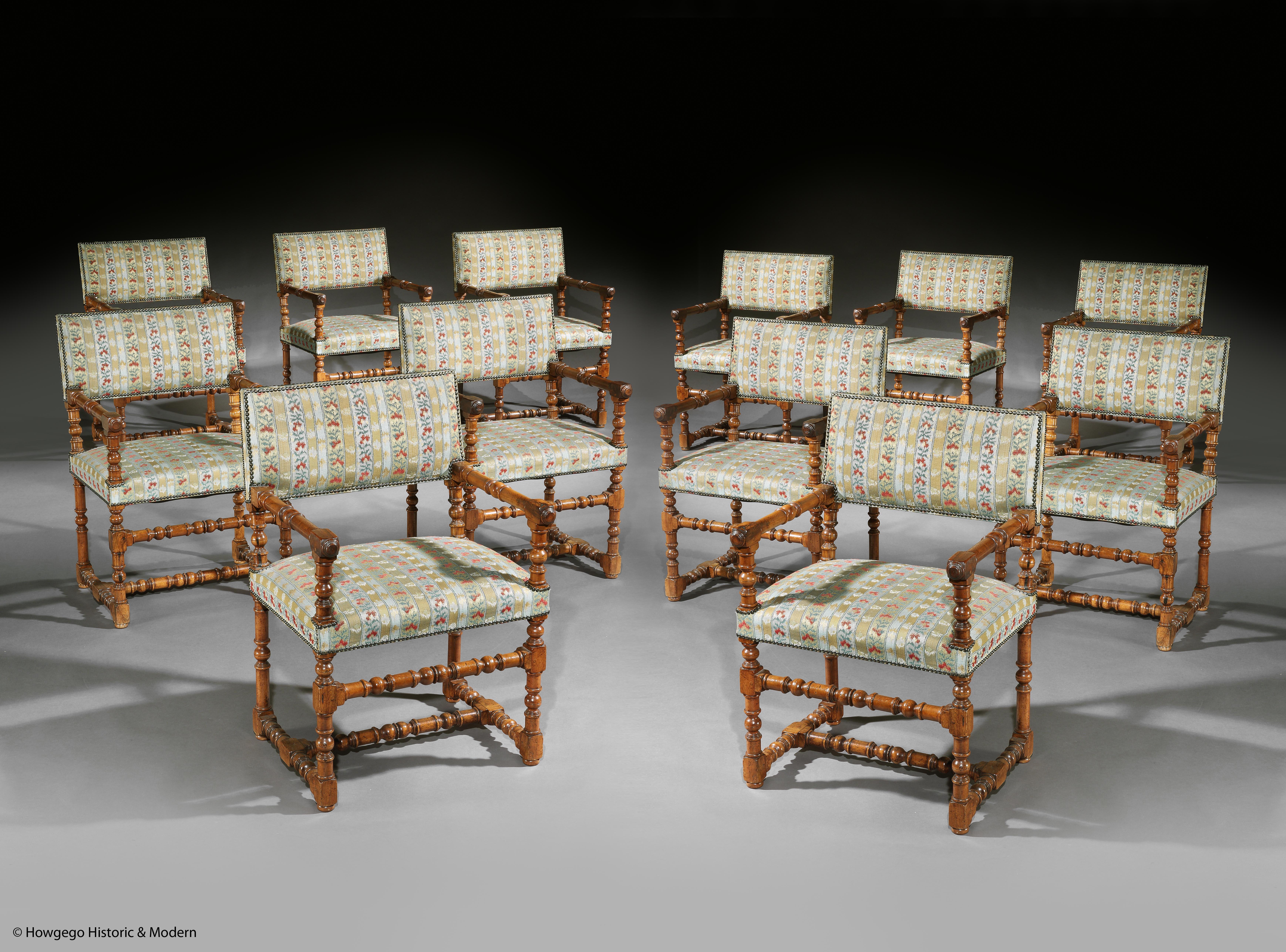 A rare long set of 12, Antiquarian, Renaissance-style, Fruitwood, Upholstered, Open Armchairs

- Rare to find a set of 12 of a Renaissance-style armchair, in 35 years of dealing I have not come across a set of this model
- The model evolved from