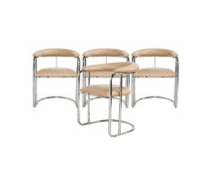 Twelve Sleek Chrome Dining Chairs by Anton Lorenz for Thonet