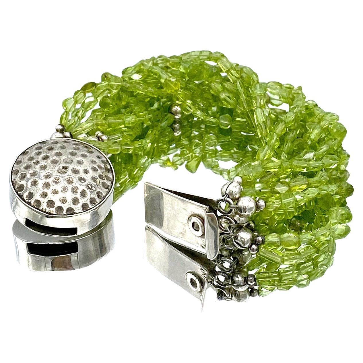 Women's Twelve Strand Peridot Bracelet with Hammered Sterling Silver Clasp