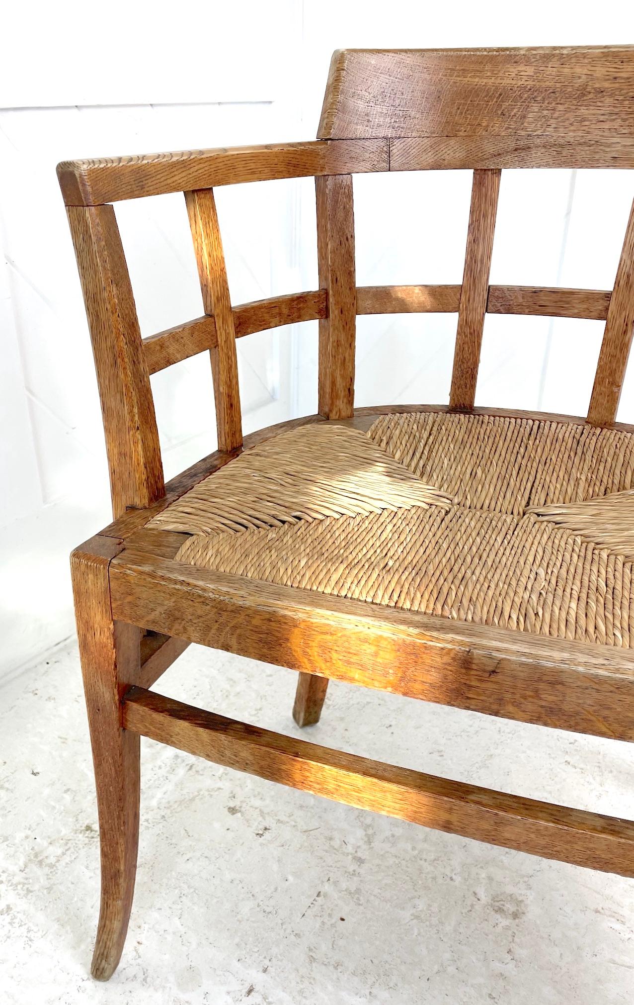 This is an oak lattice back desk chair with shaped arms and drop-in rush seat
Retailed and designed by Heals
Circa 1920
Sir Ambrose Heal 1872 -1915 — HEAL & SON
Ambrose Heal was the great-grandson of John Harris Heal, founder of the Heals