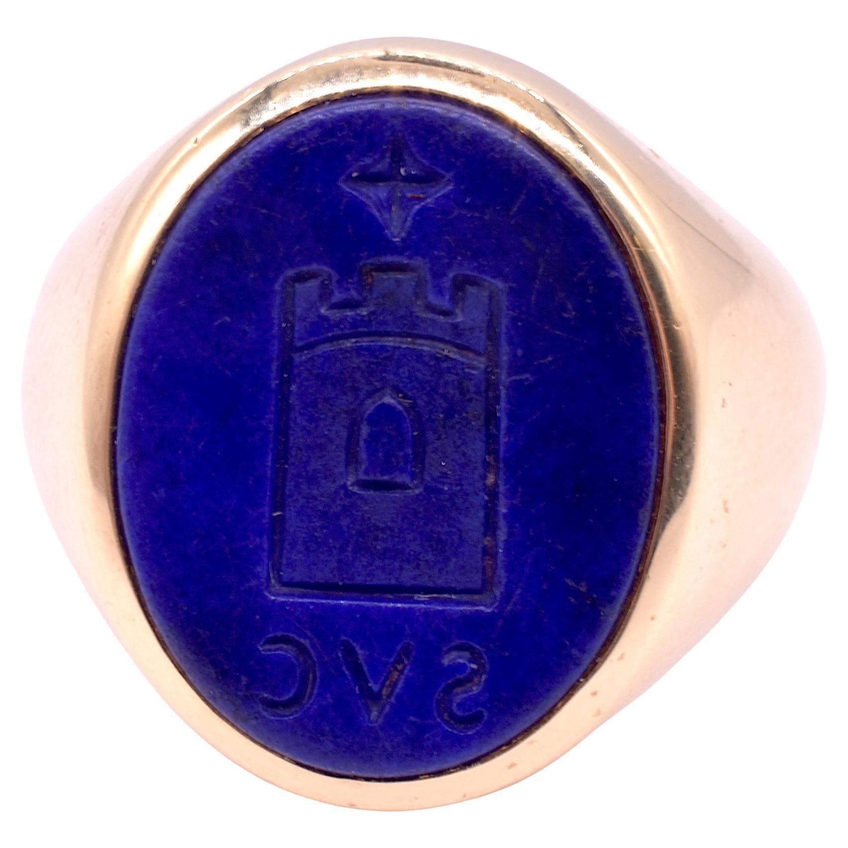 Twentieth Century 14 Karat Blue lapis lazuli signet ring of German or Austrian origin, with initials SVC and a charming intaglio of a stylized castle.  The band has a purity mark of 585 on one side and  a maker's mark on the other. The ring is hand