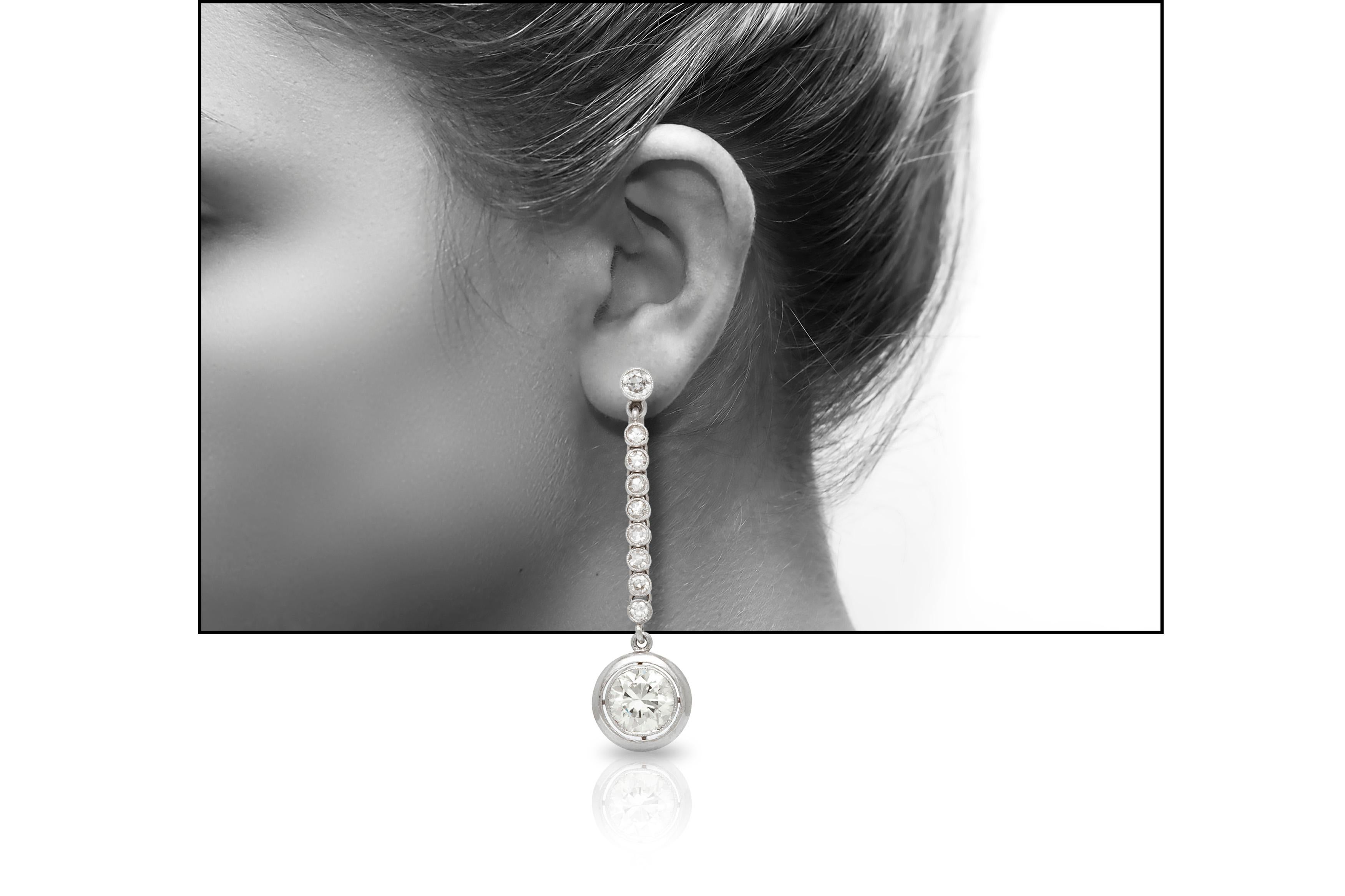 The earrings is finely crafted in platinum and 18k the post with two big stone weighing approximately total of 4.00 and the rest of the diamonds is weighing approximately total of 0.90carat.
