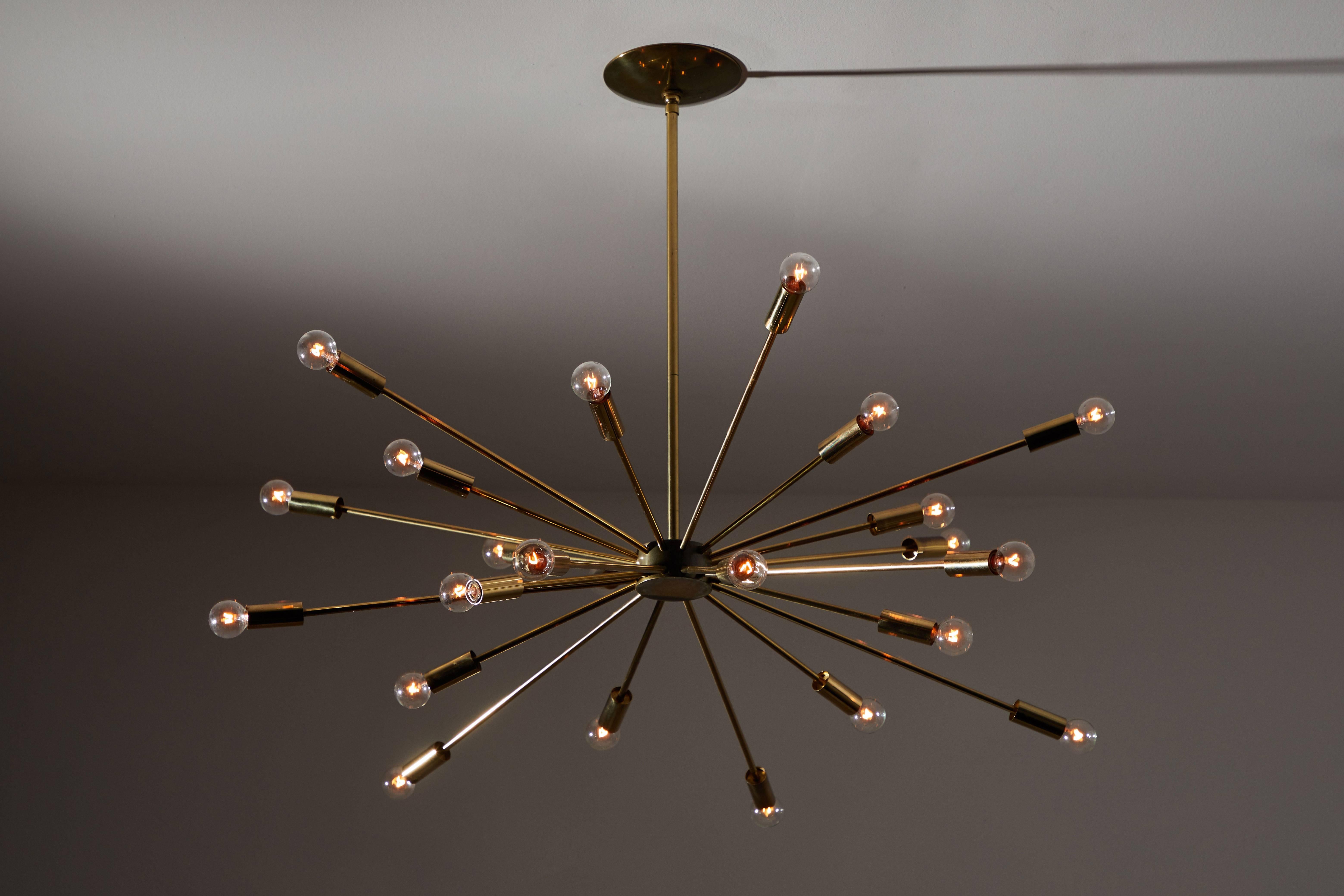 Twenty-Four-Arm Chandelier by Gino Sarfatti for Lightolier. Designed and manufactured in Italy, circa 1950s. Brass arms and hardware. Wired for US junction boxes. Takes 24 E14 European candelabra bulbs.
