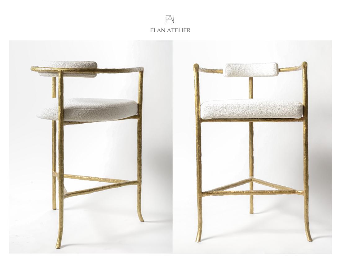 Bronze Twig Barstool with cast gold-bronze frame and ivory boucle upholstery by Elan Atelier

Inspired by the sculpture of Alberto Giacometti, the twig barstool is a sculptural form cast in solid bronze. Custom sizes, finishes, and various