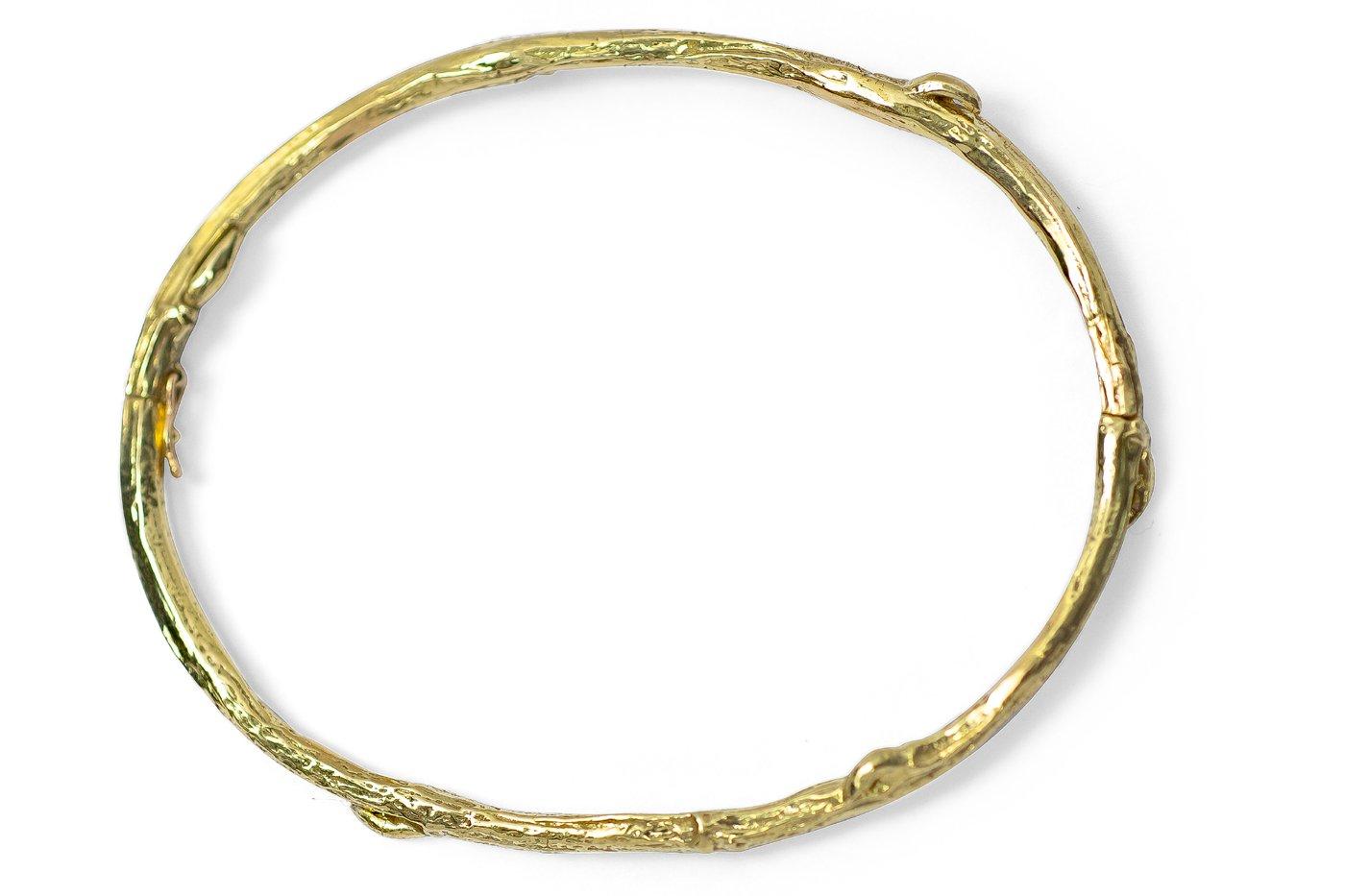 You'll remember to flex and bend with life's winds every time you glance at this golden twig wrapped gently around your wrist. A perfect everyday piece, this snug-fitting 18k gold bangle has a hinge and clasp closure.

GS18kTwigBr- Tight fitting